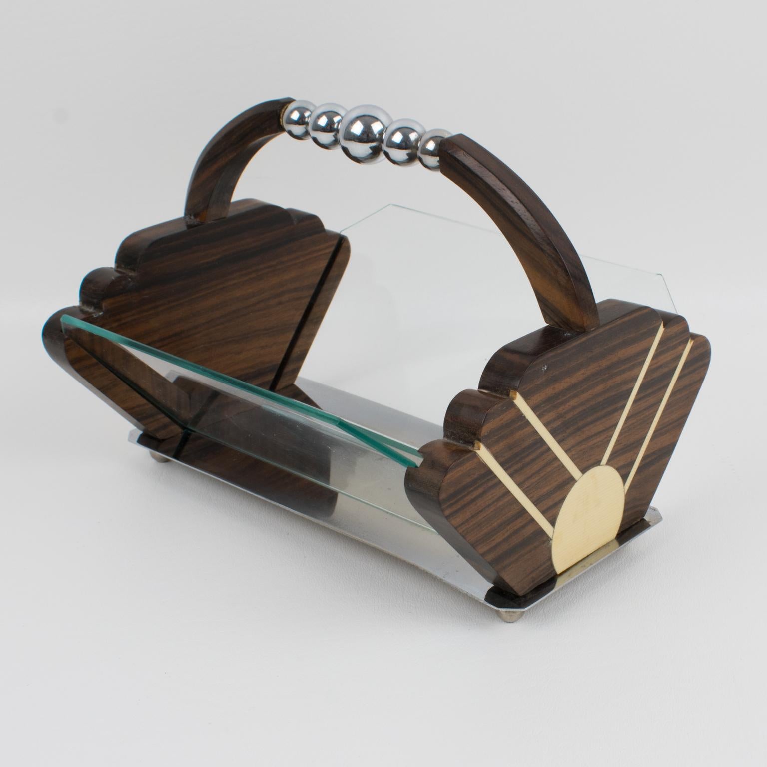 This stunning French Art Deco centerpiece, serving bowl, or decorative fruit or bread basket features a Macassar wood handle ornate with chromed metal beads. Each side of the framing is in Macassar wood with an off-white Galalith decoration. Two