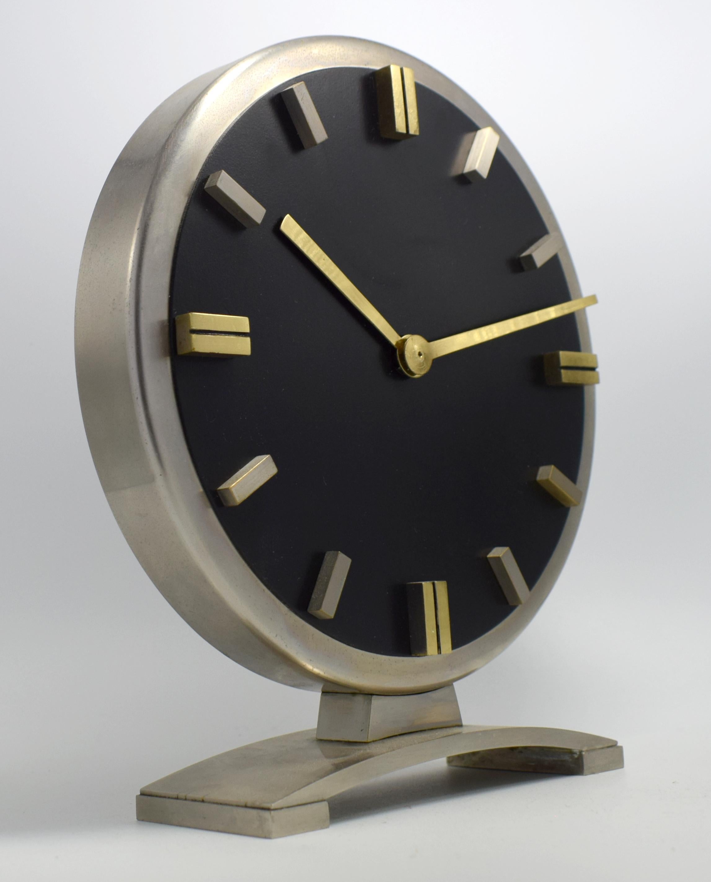 Weighing in at nearly 1.5 kilos this is not only an impressive looking clock but deceptively heavy when you handle it. Although there's no makers name there is an undeniable quality to this clock and would hazard a guess it's probably German in