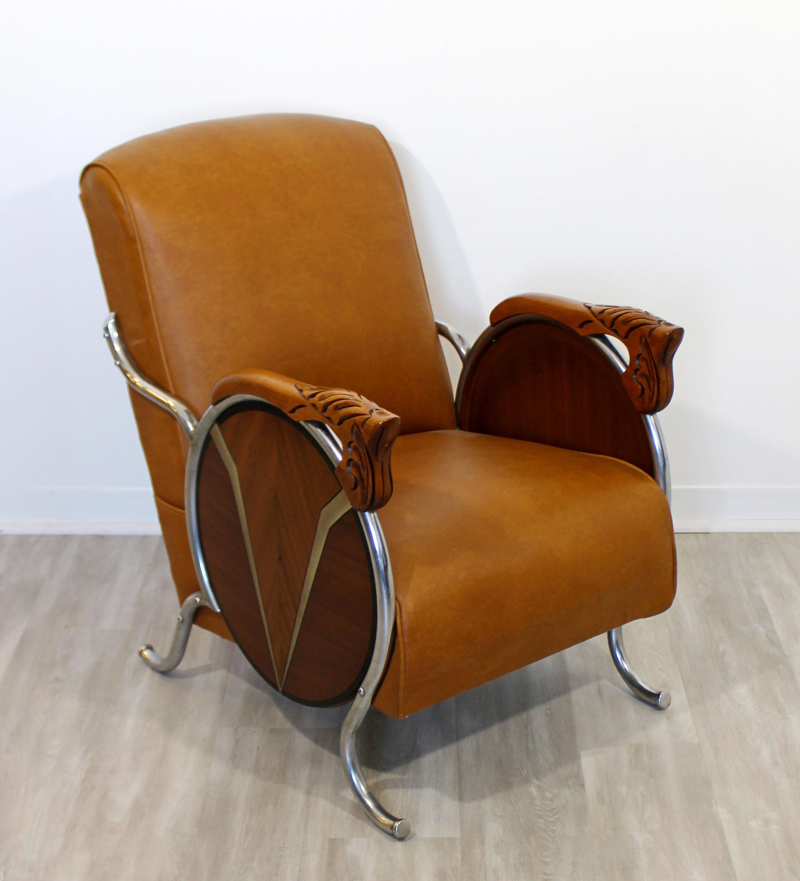 For your consideration is a luxuriously sleek, curved chrome and carved wood armchair, with soft as butter brown upholstery, circa the 1940s. In excellent antique condition. The dimensions are 23.5