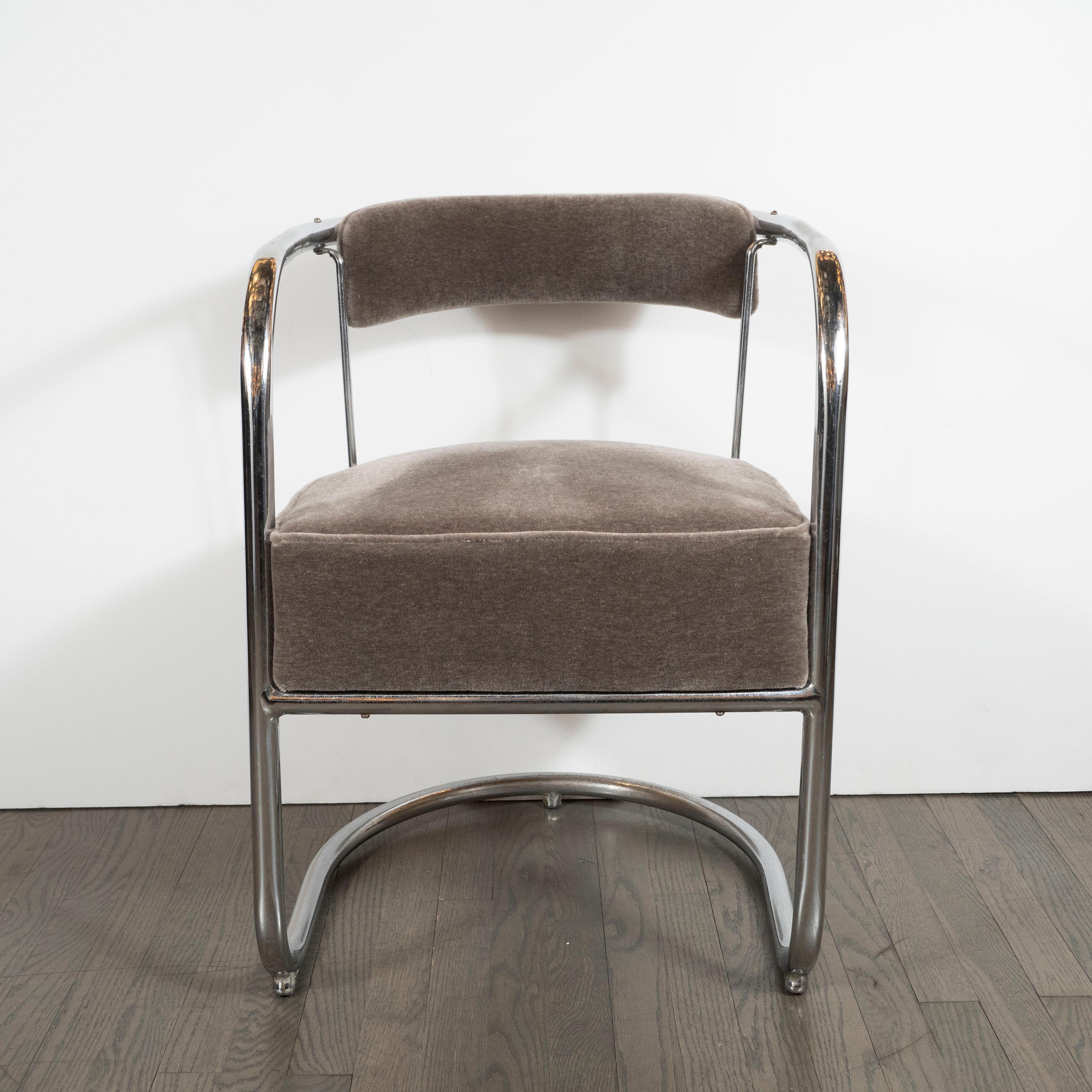 This refined side chair was realized by the esteemed 20th century designer, Gilbert Rohde, in the United States, circa 1940. It features a curvilinear body composed of a single piece of tubular bent steel that forms the matching U-form back and