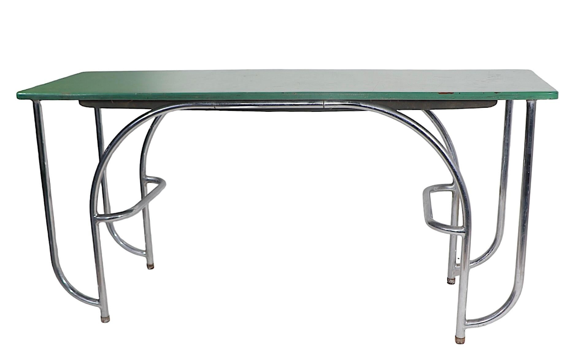 Exceptional Art Deco, Machine Age  console table designed by KEM Weber for Lloyd Furniture Company circa 1930's. The table features a stylized tubular chrome base, which supports the painted  wood top.  Originally designed as a console table, this