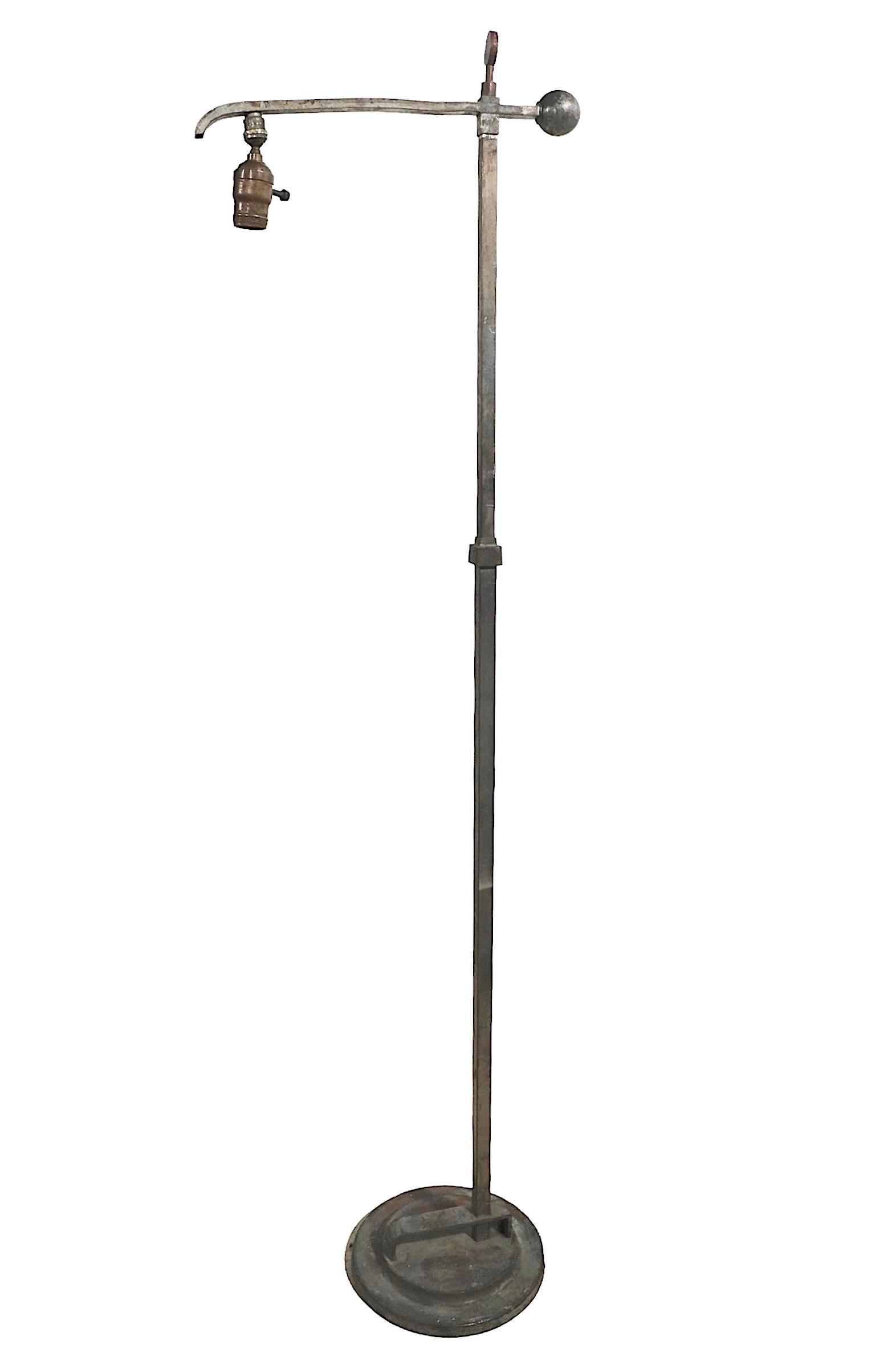 Rare Machine Age floor lamp designed by Donald Deskey for Deskey Vollmer Inc. circa 1930’s. This example shows considerable wear to the finish, a slight dent in the arm element, and general signs of age and use, it is selling in as found condition.