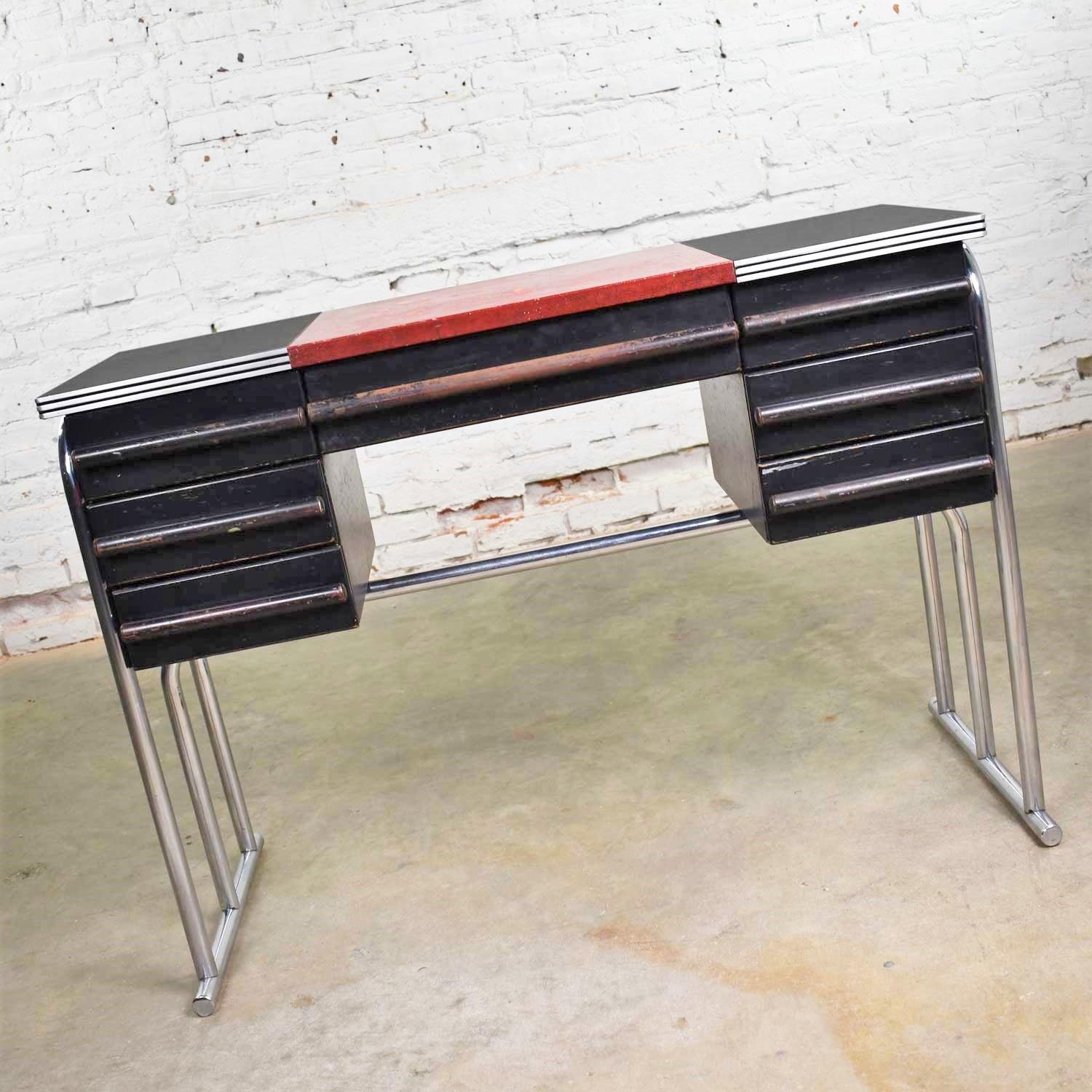 Fabulous Art Deco, Machine Age, Streamline Modern, Art Moderne, International style, Bauhaus desk or vanity in chrome, black painted wood with red faux leather insert possibly Fabrikoid and Bakelite or Cat-O-Lite (Catalin) top. This desk is