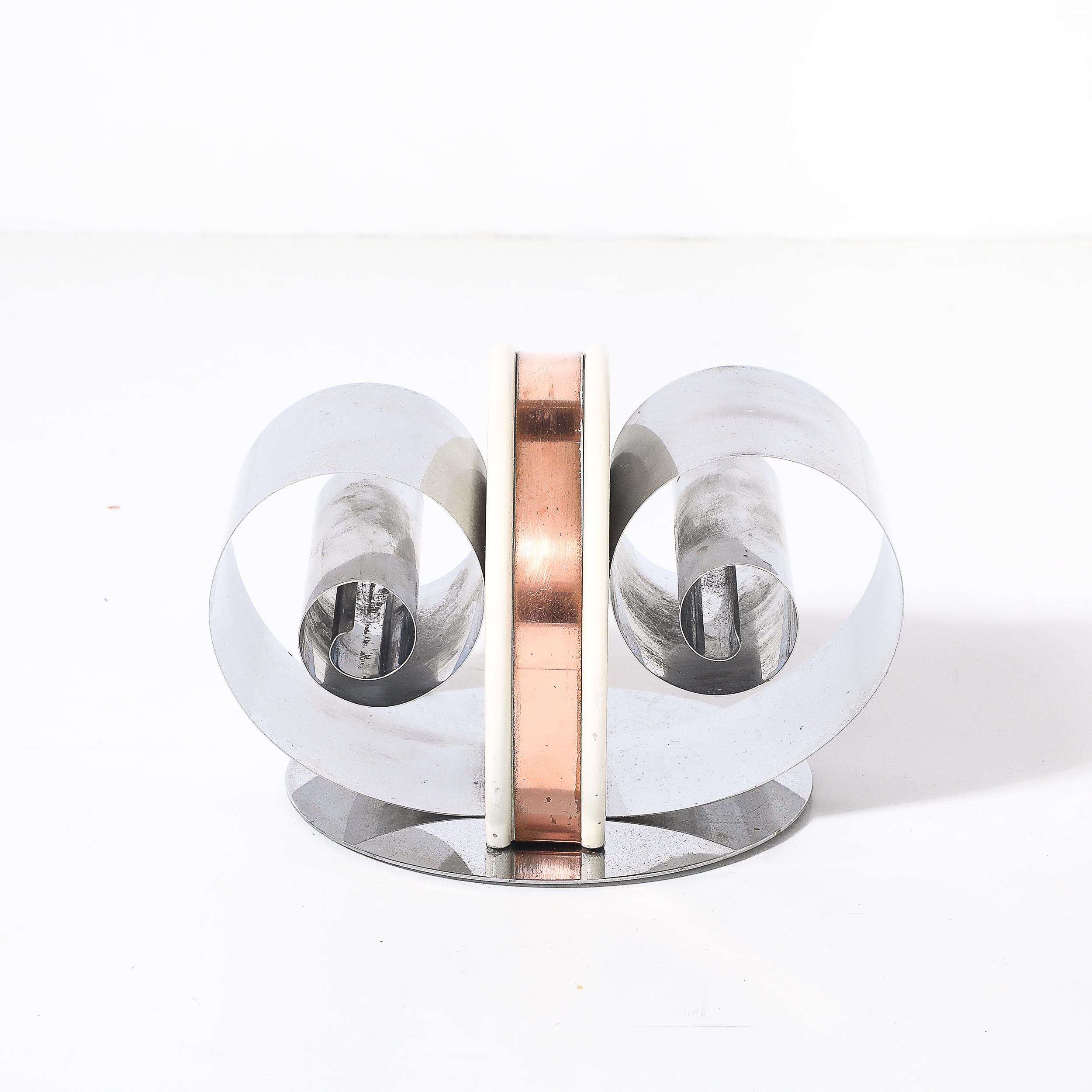 This stunning Art Deco Machine Age paper/book holder, created in America circa 1935, is an exceptional example of the fusion of design innovation and functionality characteristic of the Machine Age movement. Crafted with an emphasis on clean lines