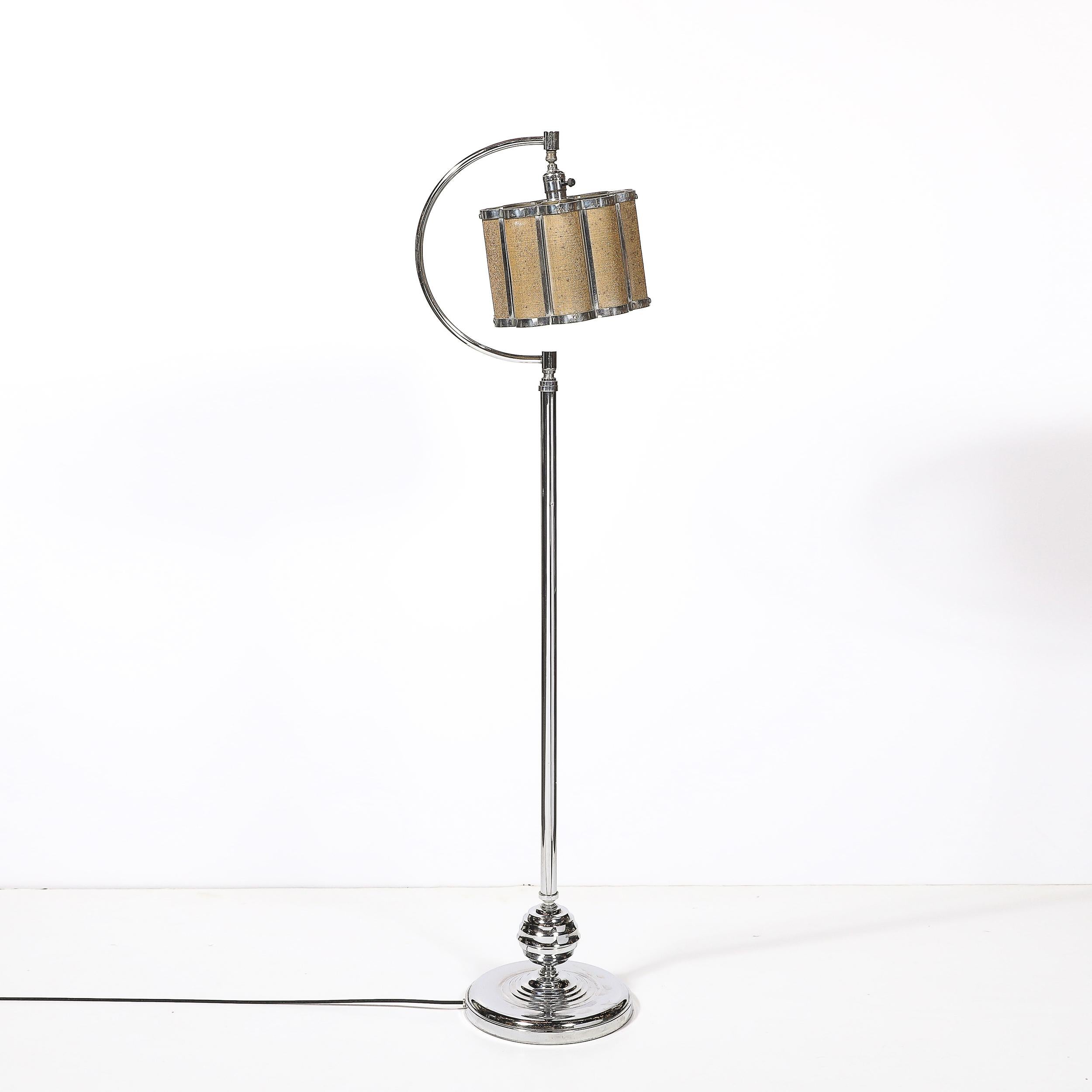 This striking Art Deco Machine Age floor lamp, crafted in America circa 1935, is an exemplar of the era’s bold industrial aesthetics and innovative functionality. Featuring polished chrome construction combined with a scalloped gilt metal mesh