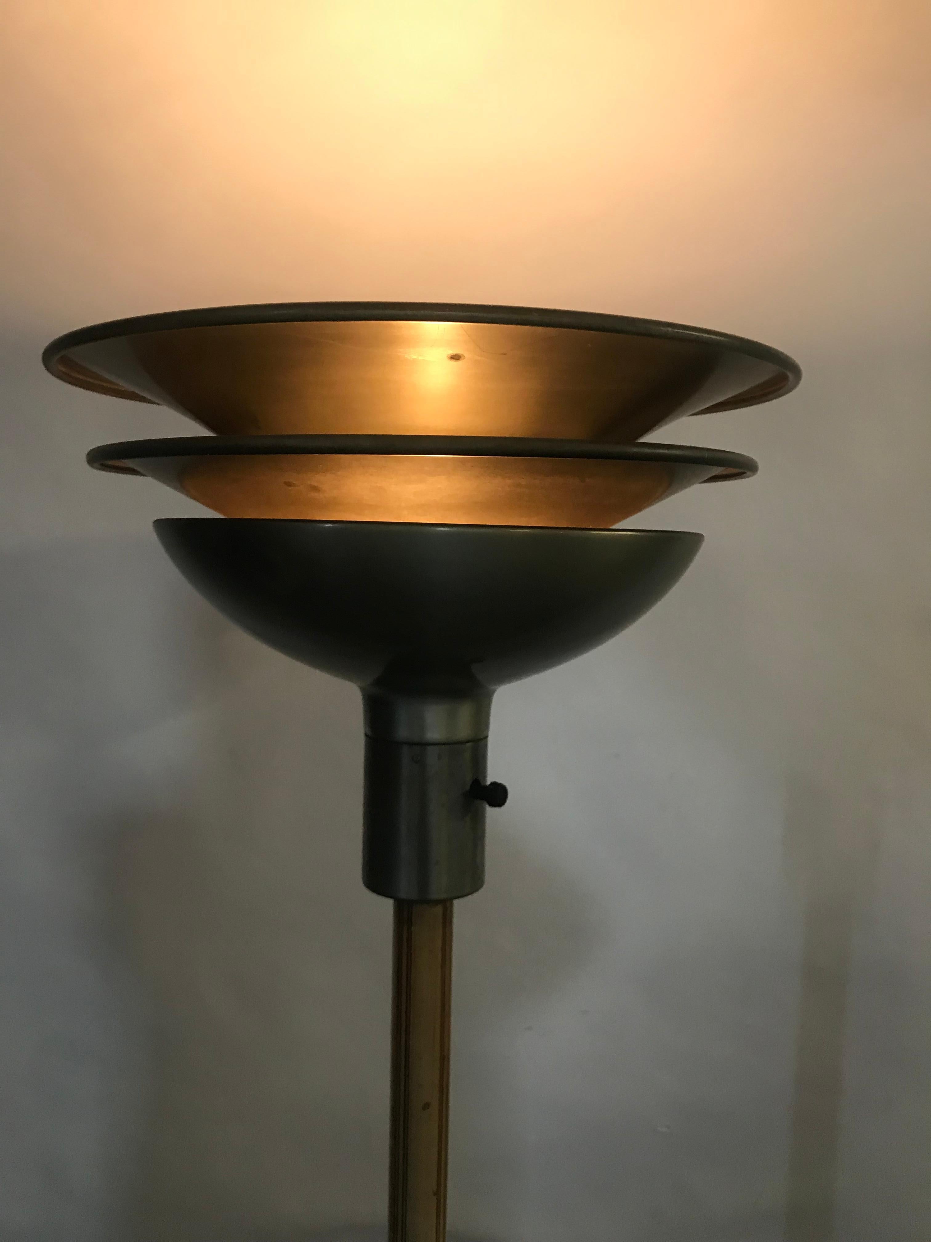 Classic 1930s Art Deco, modernist triple-tier torchere by Gilbert Rohde for Mutual Sunset Lamp Co, retains original finish, minor dent to standard.