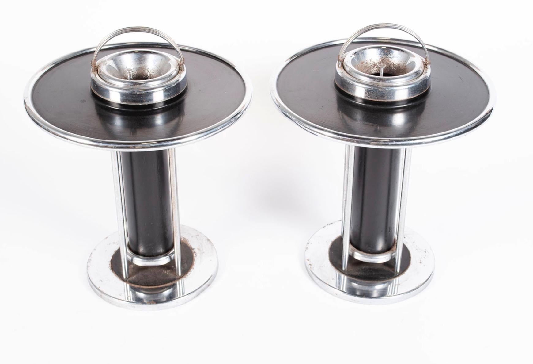 Wolfgang Hoffman 1934 Art Deco smoking stands for Howell. Chrome-plated steel. Rounded handle, chrome hinged receptacle, black lacquered table surface ab one cylindrical standard and terminating in round chrome base. Howell Exclusive design label to