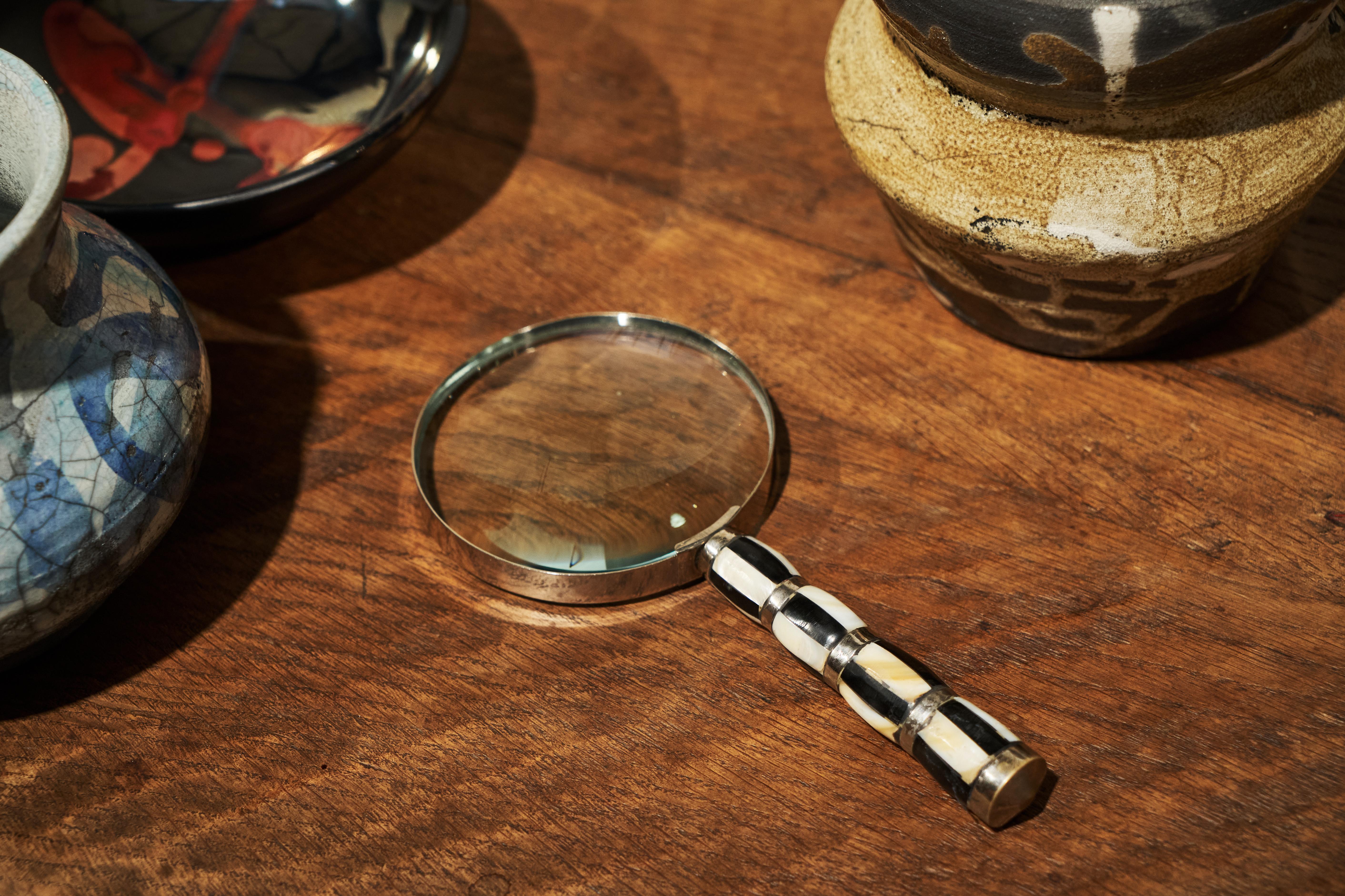 Art Deco Magnifying Glass in Mother of Pearl and Silver Plate 1930s

Sometimes, the only quality an item really needs is beauty - and this art deco magnifying glass has it all. Age, quality and an outstanding choice of materials; mother of pearl and