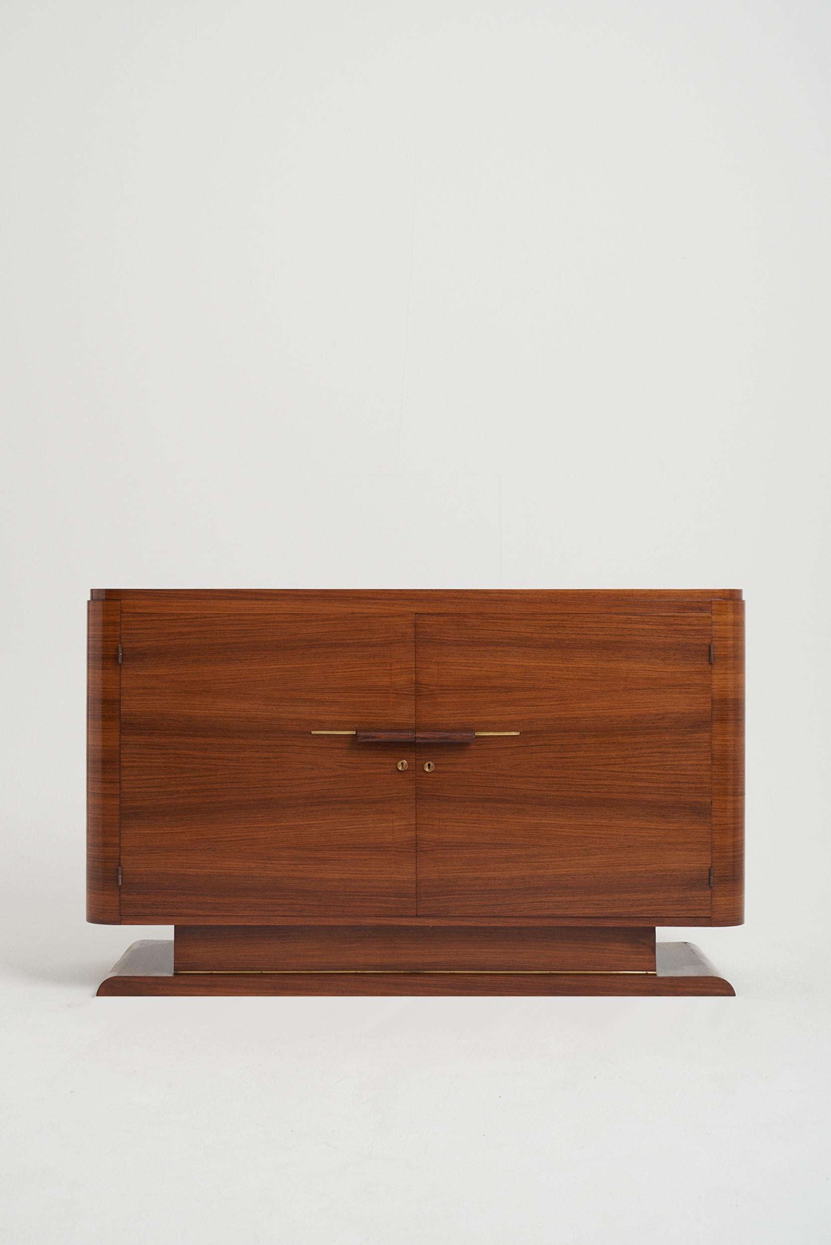 An Art Deco mahogany and brass mounted sideboard.
France, circa 1930.