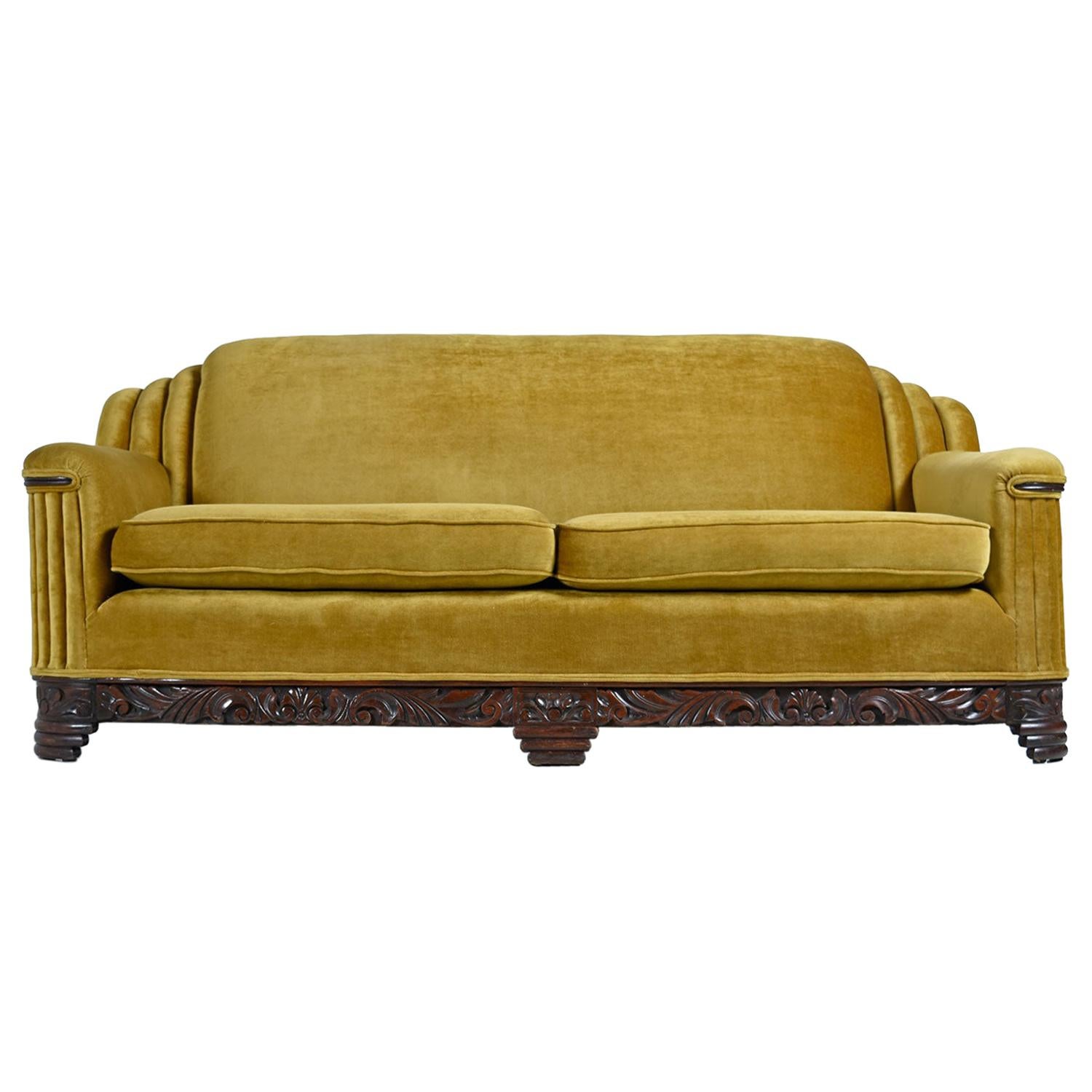 The soft and sensuous gold bronze mohair is in absolutely outstanding condition. Rippled waterfall style pleated tailoring is punctuated by the hand carved mahogany base and accents on the arms. One does not have to compromise comfort for style with