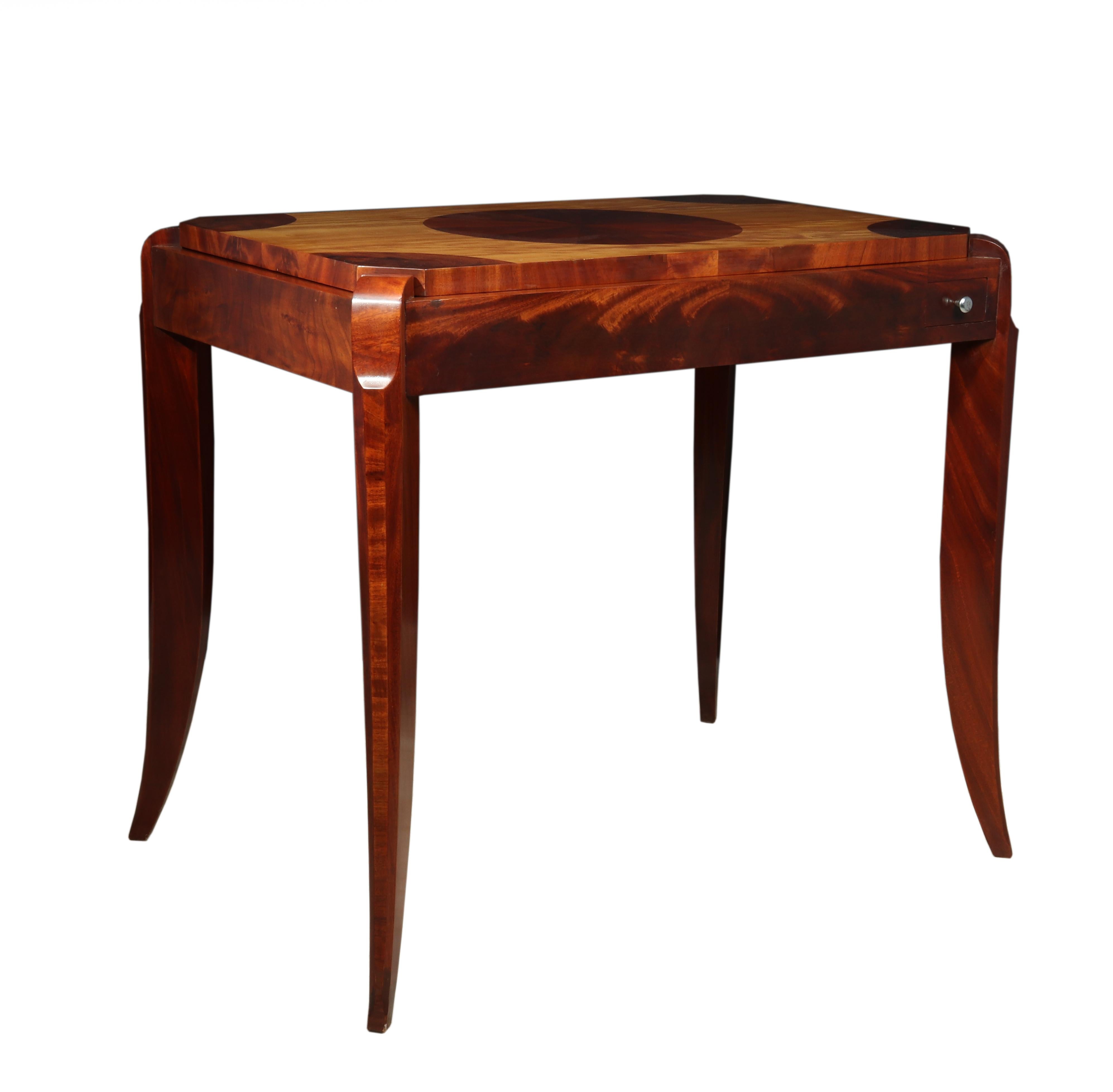 Art Deco mahogany and satinwood games table, circa 1925
This is an original French, Art Deco games table from 1925. With beautifully shaped Sabre legs, made from mahogany and satinwood. There is a segmented center circle and a chess board to the