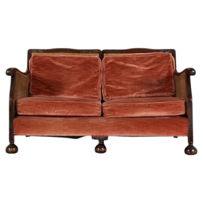 Art Deco Mahogany Bergere Style Sofa with Cane Details and Ball Feet
