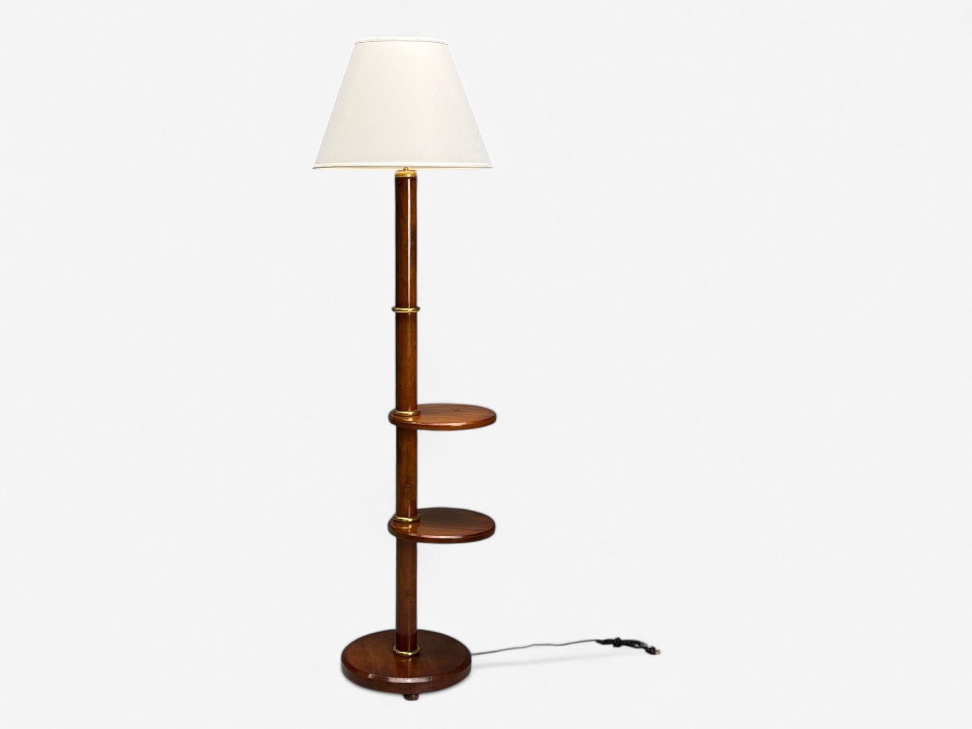 Art Deco, Mahogany, Bronze, Modern Floor Lamp with Shelves, USA, 1940s

A modernist Art Deco style Mahogany and bronze floor lamp likely designed and produced in the United States c. 1940s. This example features a round base with wooden feet