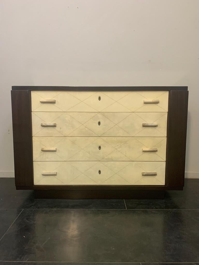 Art Deco chest of drawers in mahogany with parchment handles, 1940s.