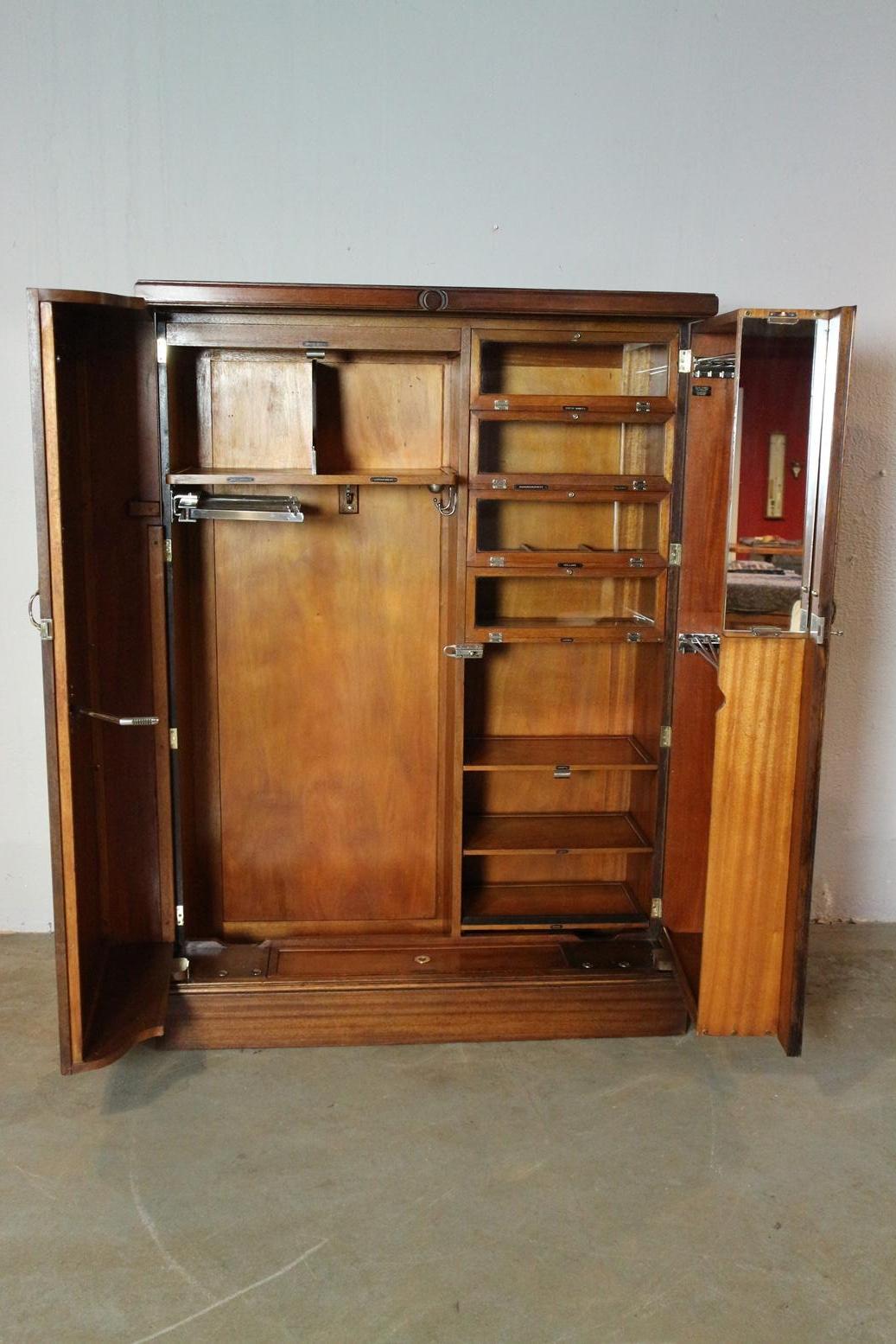 Beautiful antique mahogany Compactom wardrobe in perfect and completely original condition. Compactom wardrobe with the beautiful interior where there is a place for every item of clothing. Inside is equipped with compartments, shelves, hooks and