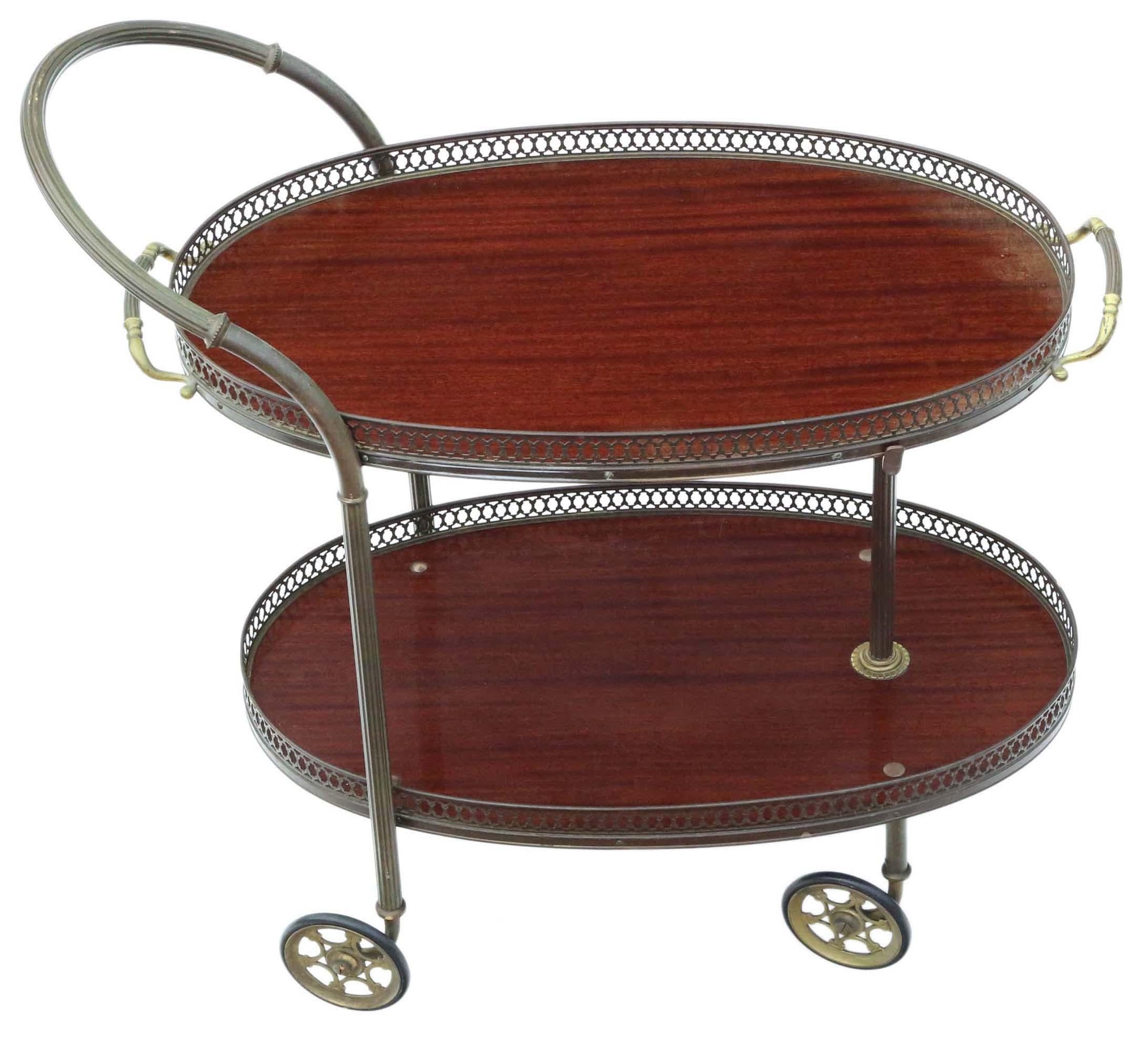Antique, rare Art Deco mahogany drinks trolley and cake serving table, featuring impressive wheels that add to its allure.

This beautiful and uncommon piece exudes quality, showcasing age, charm, and character. The serving tray can be lifted off