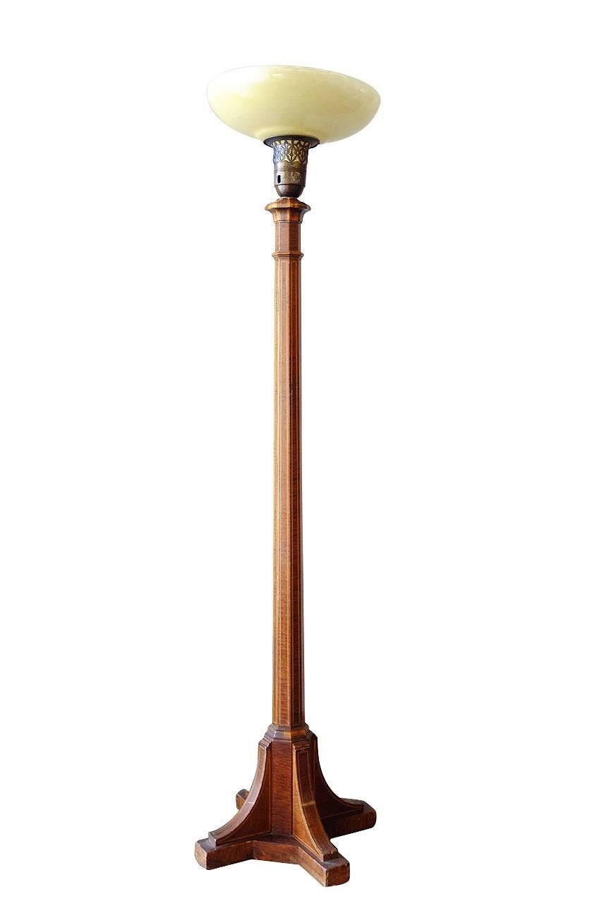 Mahogany torchiere floor lamp pair with wood inlays and milk glass shade, circa 1920.
