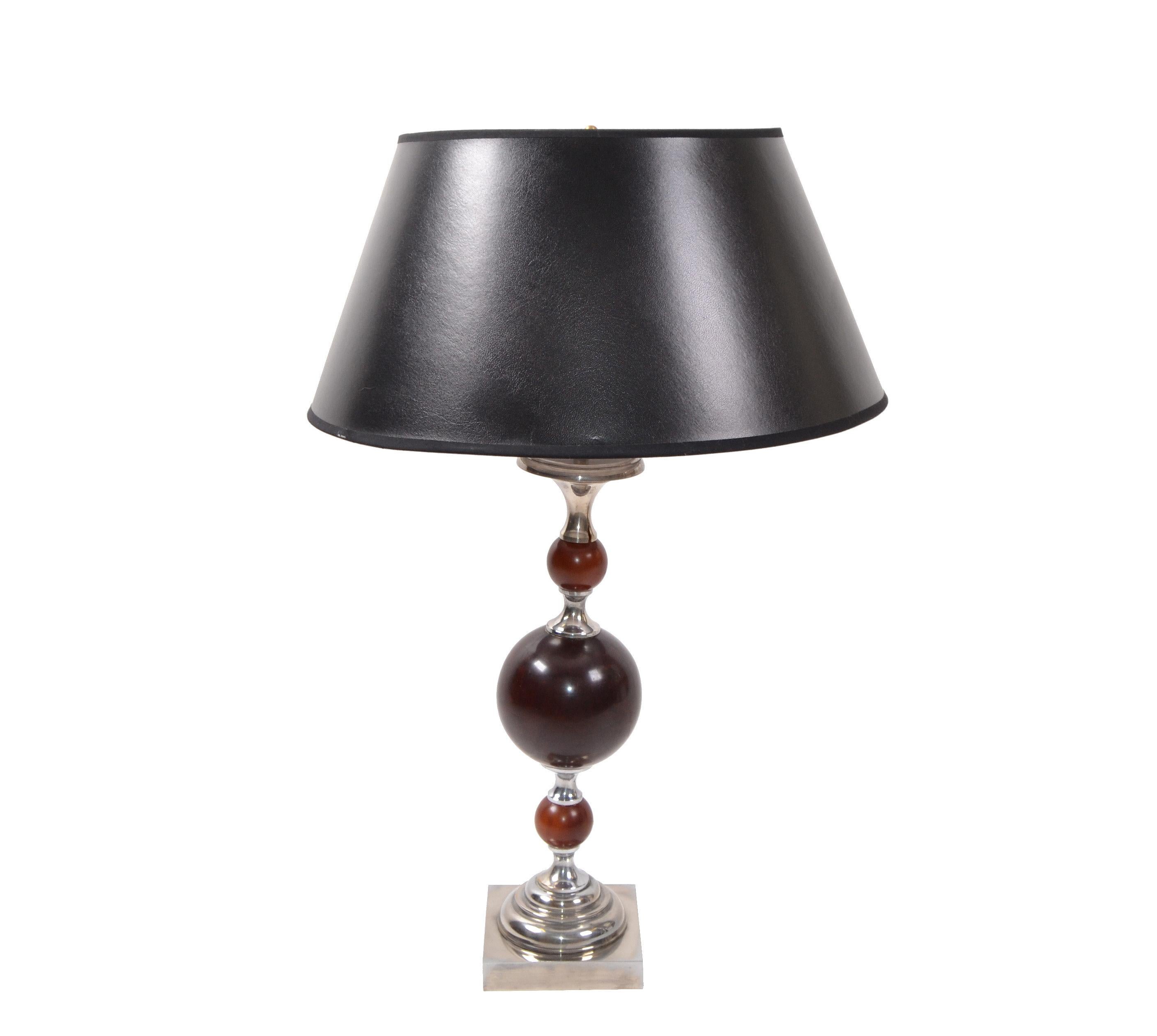 Superb Art Deco table lamp Maison Charles style nickel-plated finish with 3 burgundy resin spheres in the center.
US rewiring and takes one light bulb max. 75 watts, or LED bulb works perfect.
Comes with black and silver paper shade if desired.