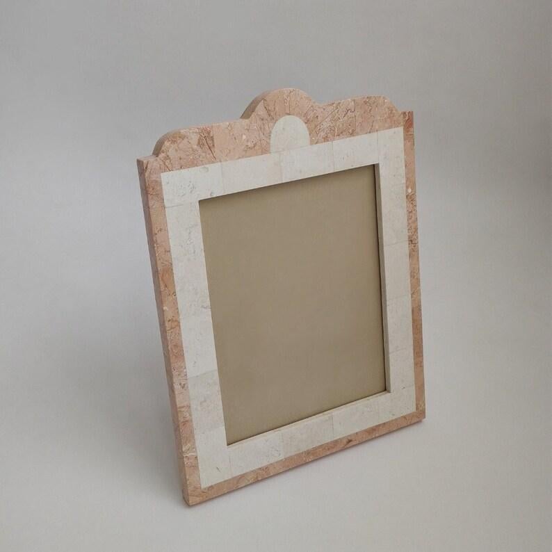 Vintage Art Deco Tessellated Stone Picture Frame
Inlaid Pink Marble & Travertine
Cream Velvet Backing
Excellent Vintage Condition

Measurements:
14-3/8