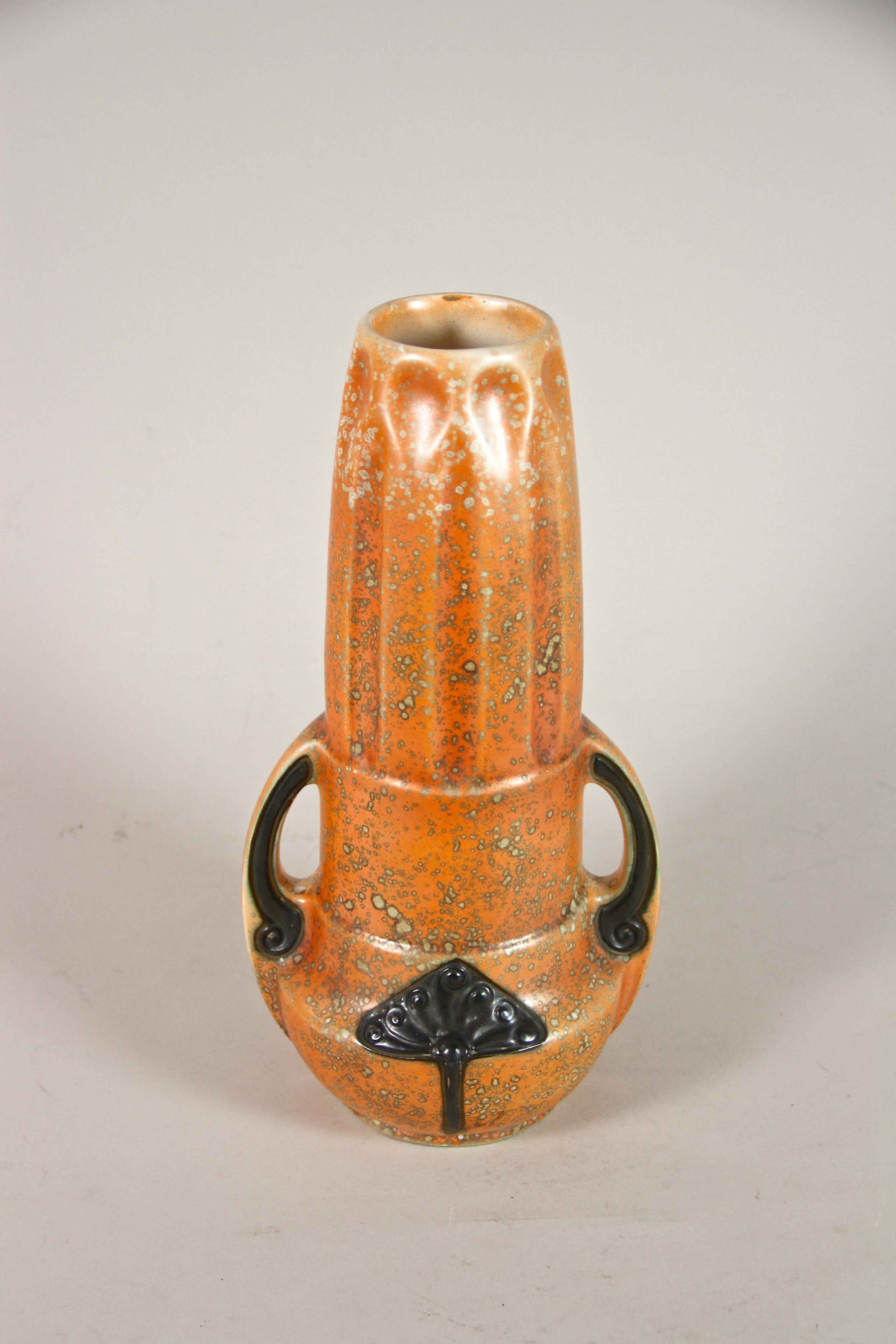 Out of the ordinary orange Art Nouveau Majolica Vase by Amphora from the early Art Deco period in the Czech Republic around 1920. The amazing shaped body shows a fantastic design with beautiful orange coloration adorned by extraordinary looking