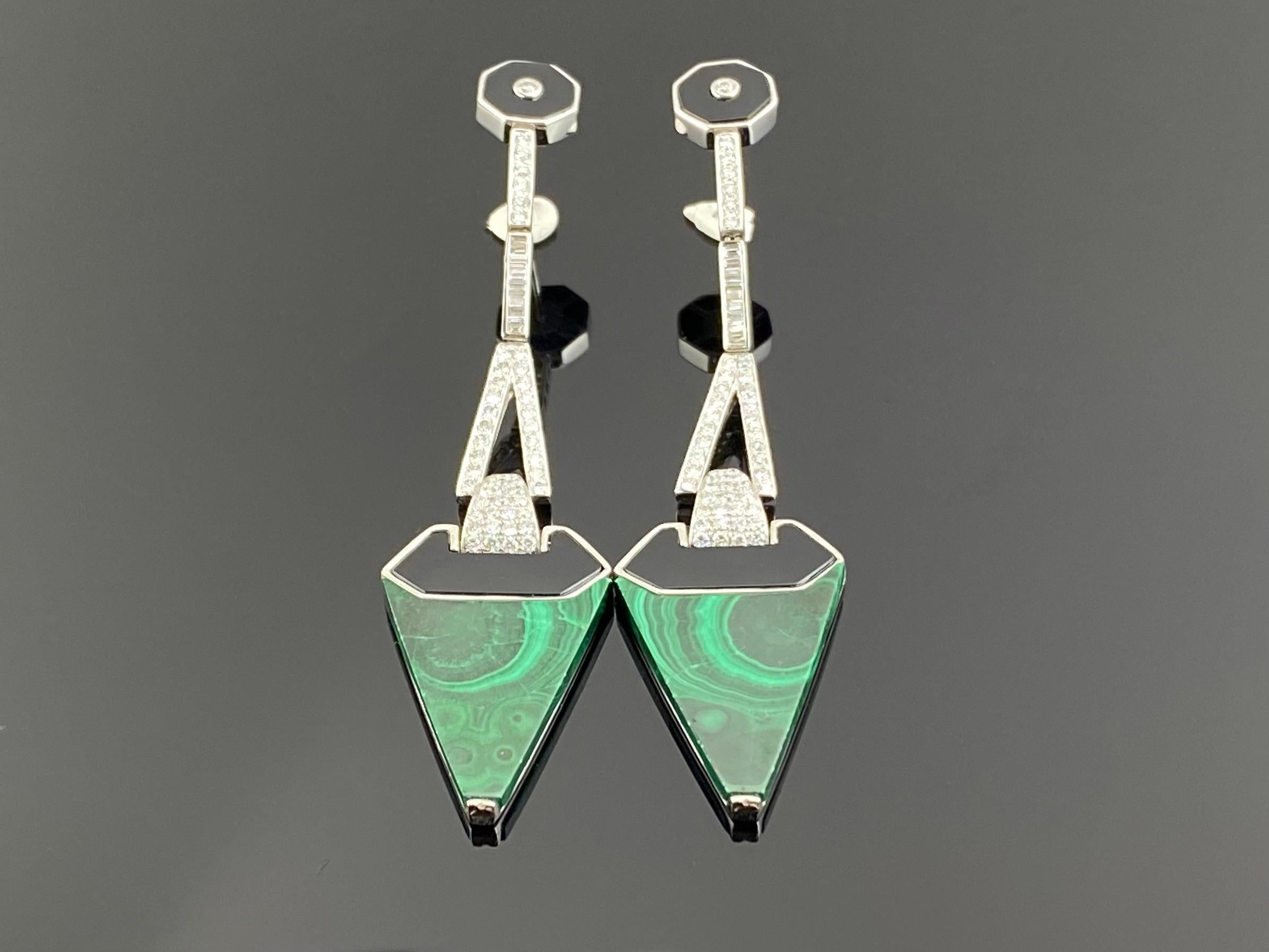 A beautiful pair of dangle earrings, with Malachite, Black onyx, 1.43 carat baguette and round cut Diamonds all set in solid 18K white gold. The earrings are around 8cm long, and comes with a push pull backing. 
We provide free shipping, and accept
