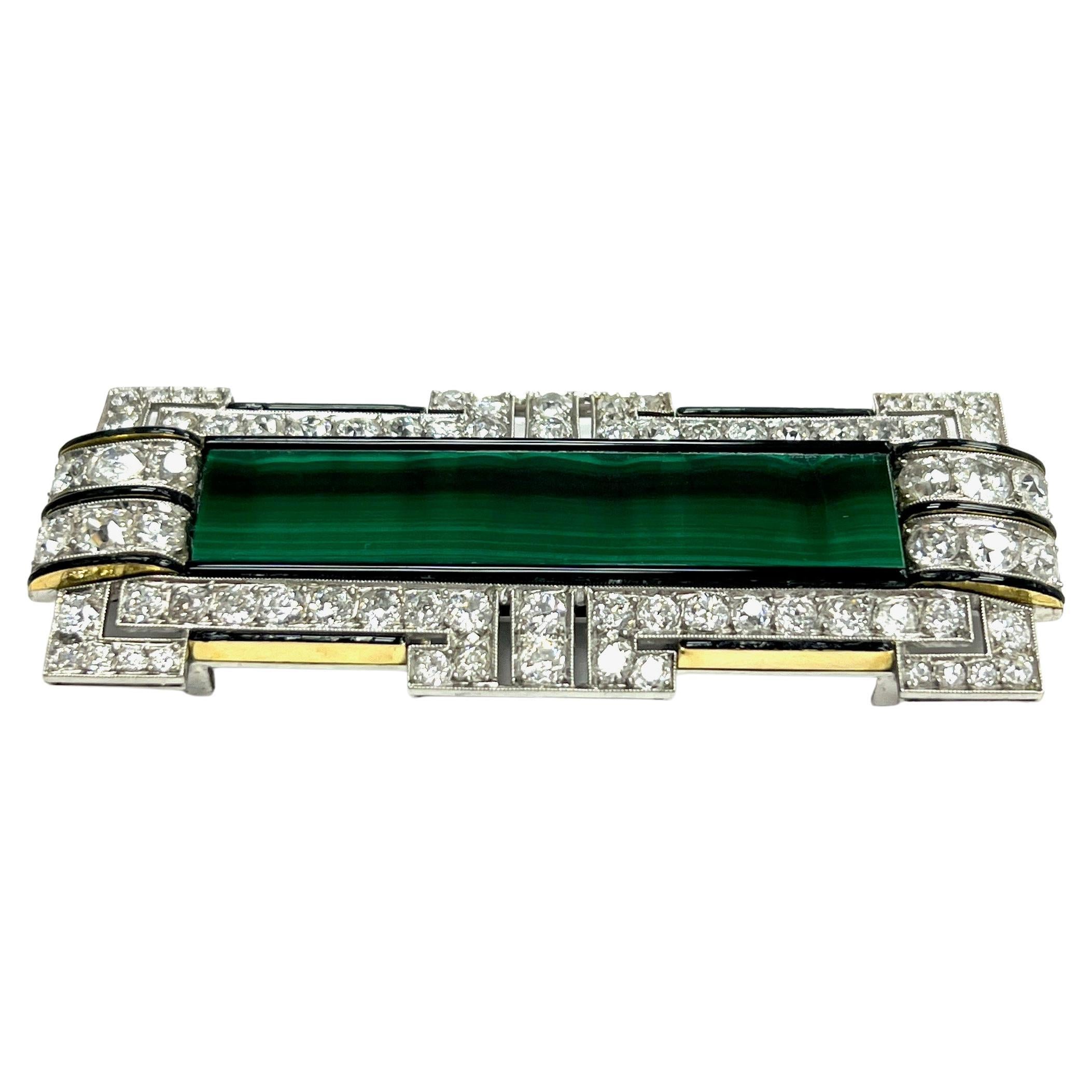 Art Deco Malachite Bar Diamond Black Onyx Pin Brooch

Old miner cut diamonds of approximately 7 carats total, with a rectangular bar of malachite (47 x 11 mm) at the center accented with black onyx; set on white gold

Size: width 2.63 inches, length