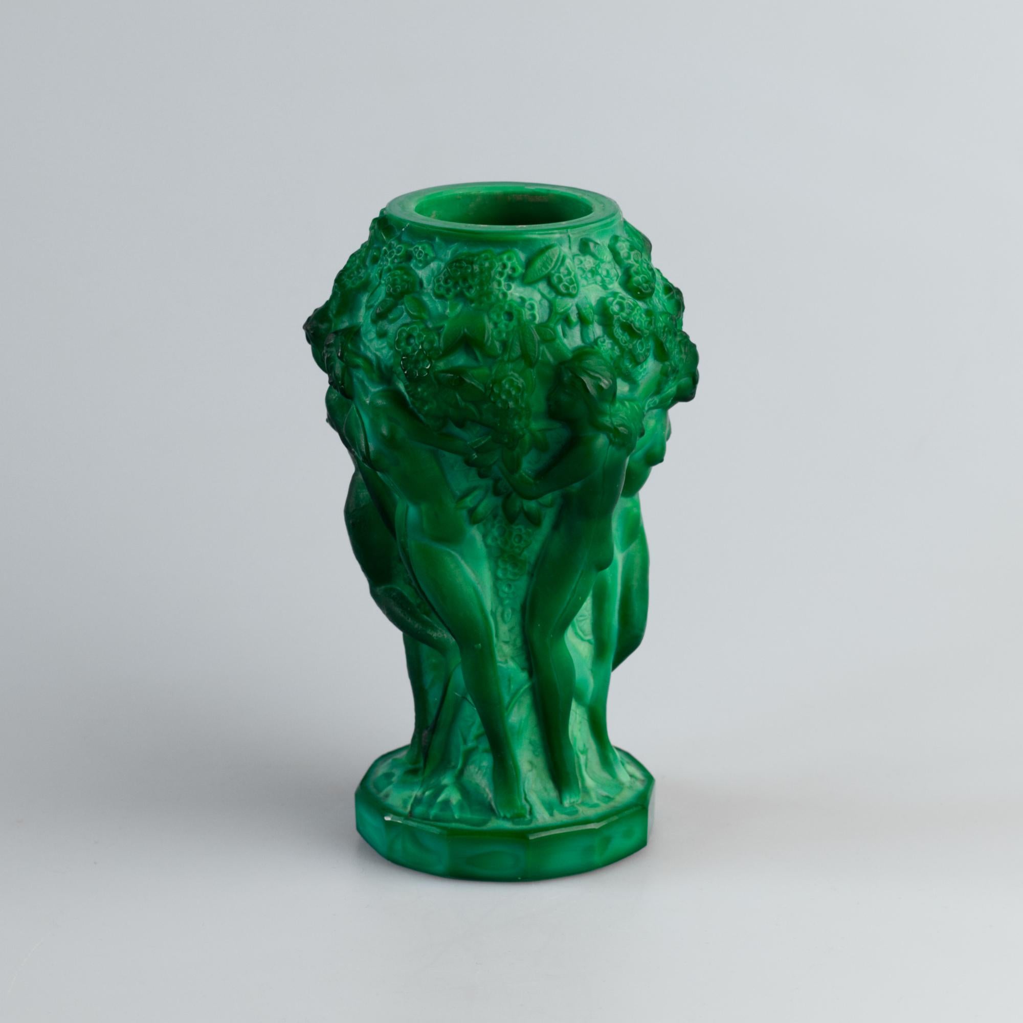 An exclusive vase made of malachite glass from the renowned Czech manufacturer Curt Schlevogt, known for creating luxury decorative glass under the Ingrid Glass brand. This exceptional piece dates back to the Art Deco period (1930–1940) and is a