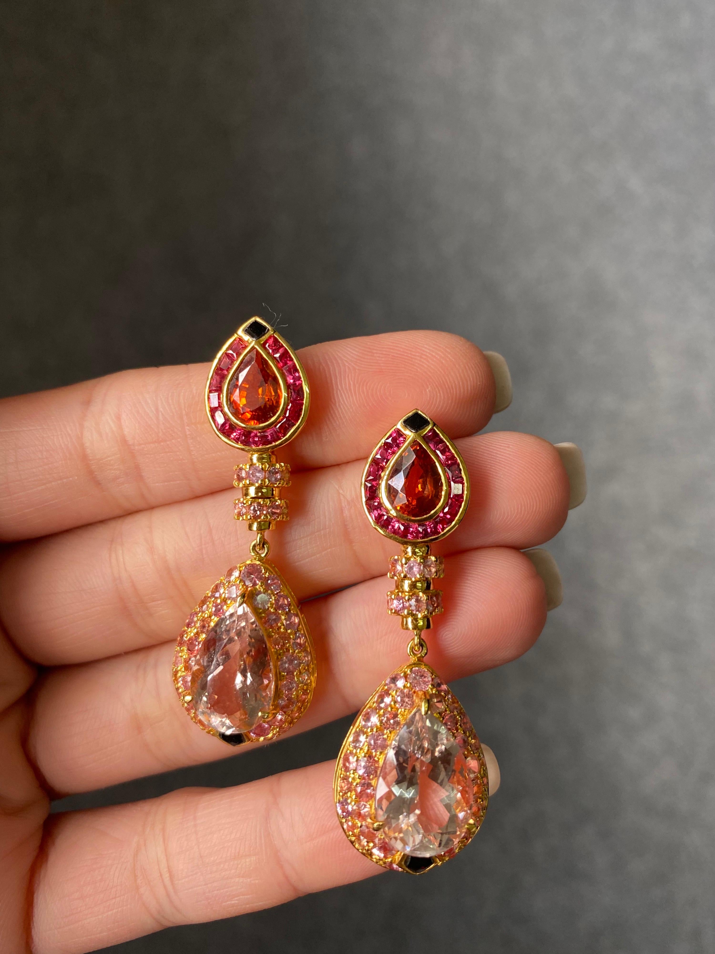 A very unique, art-deco inspired 3 carat Mandarin Garnet and 9.50 carat Kunzite earrings, with black onyx - all set in solid 18K Yellow Gold. 
The earrings are around 4cm long, and comes with a push pull backing. 
We provide free shipping and we