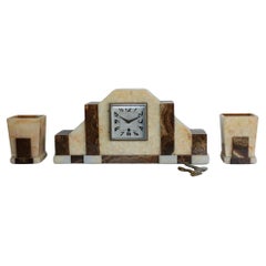 Orologio da tavolo Art Déco in marmo con guarnizioni