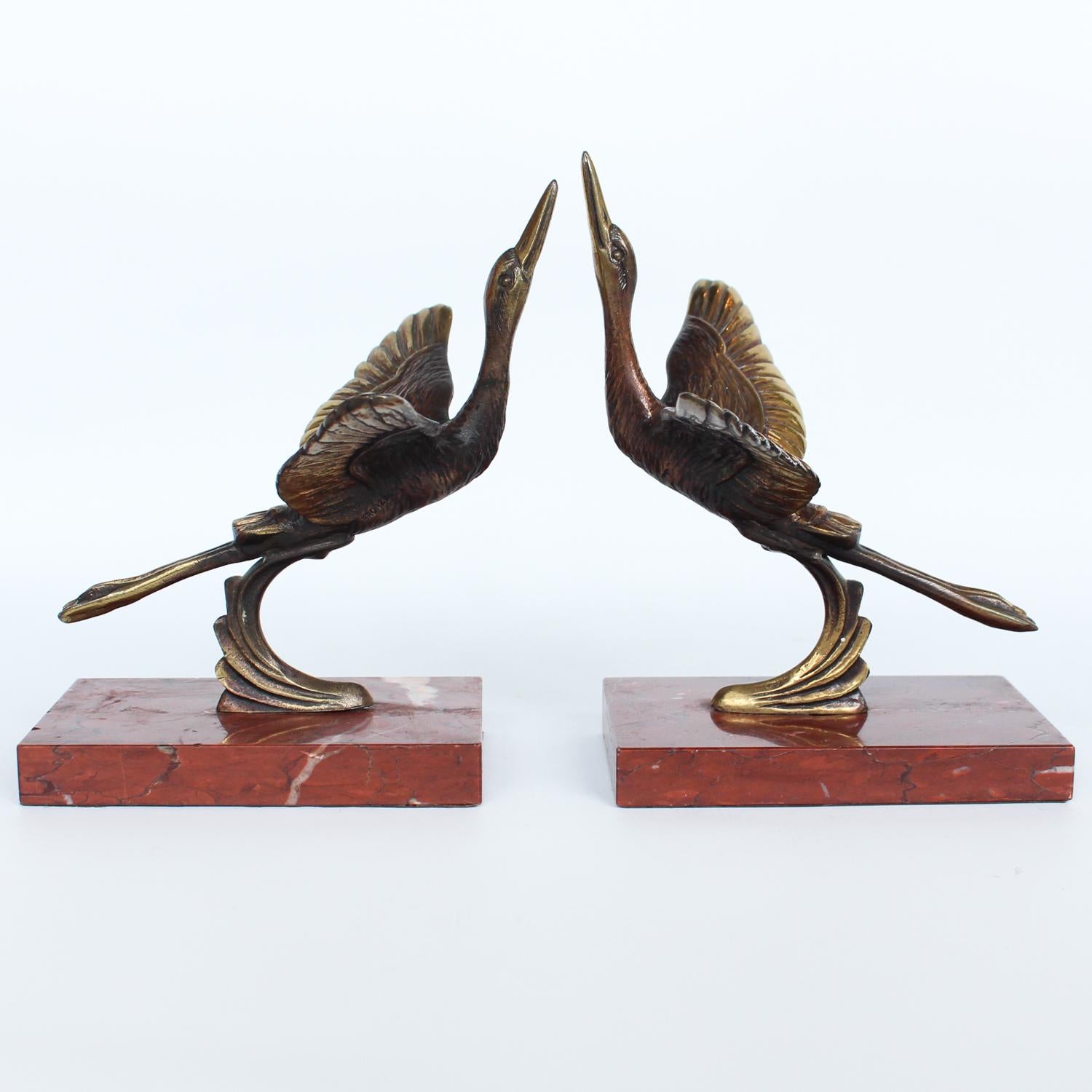 A pair of Art Deco, bronze bookends in the form of two marabou storks. 

Set over marble plinths. 




