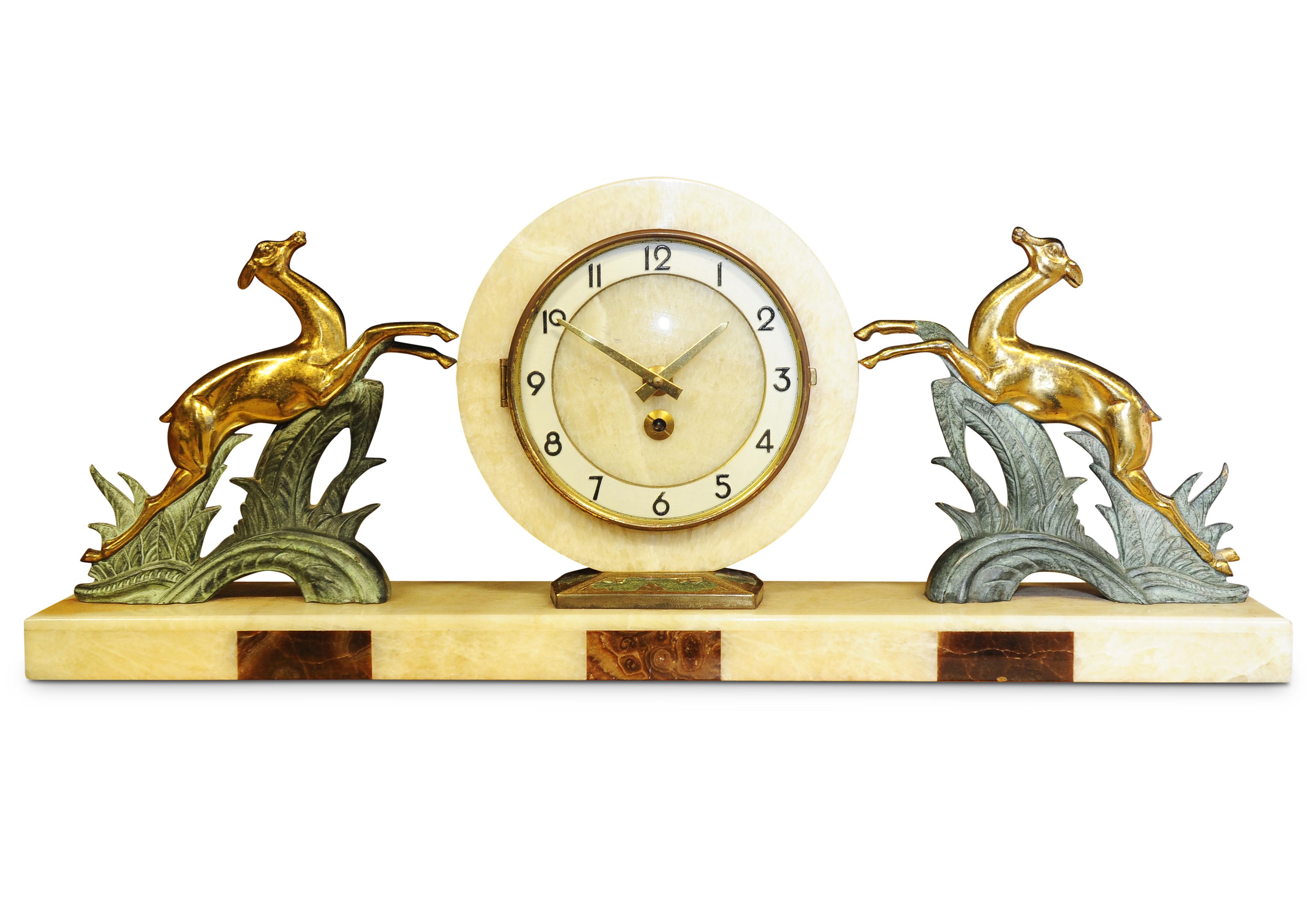 A fantastic example of a wonderful Art Deco Mantel Clock made of Marble, Spelter and Onyx by Albert Villon for Bayard from the 1930s 