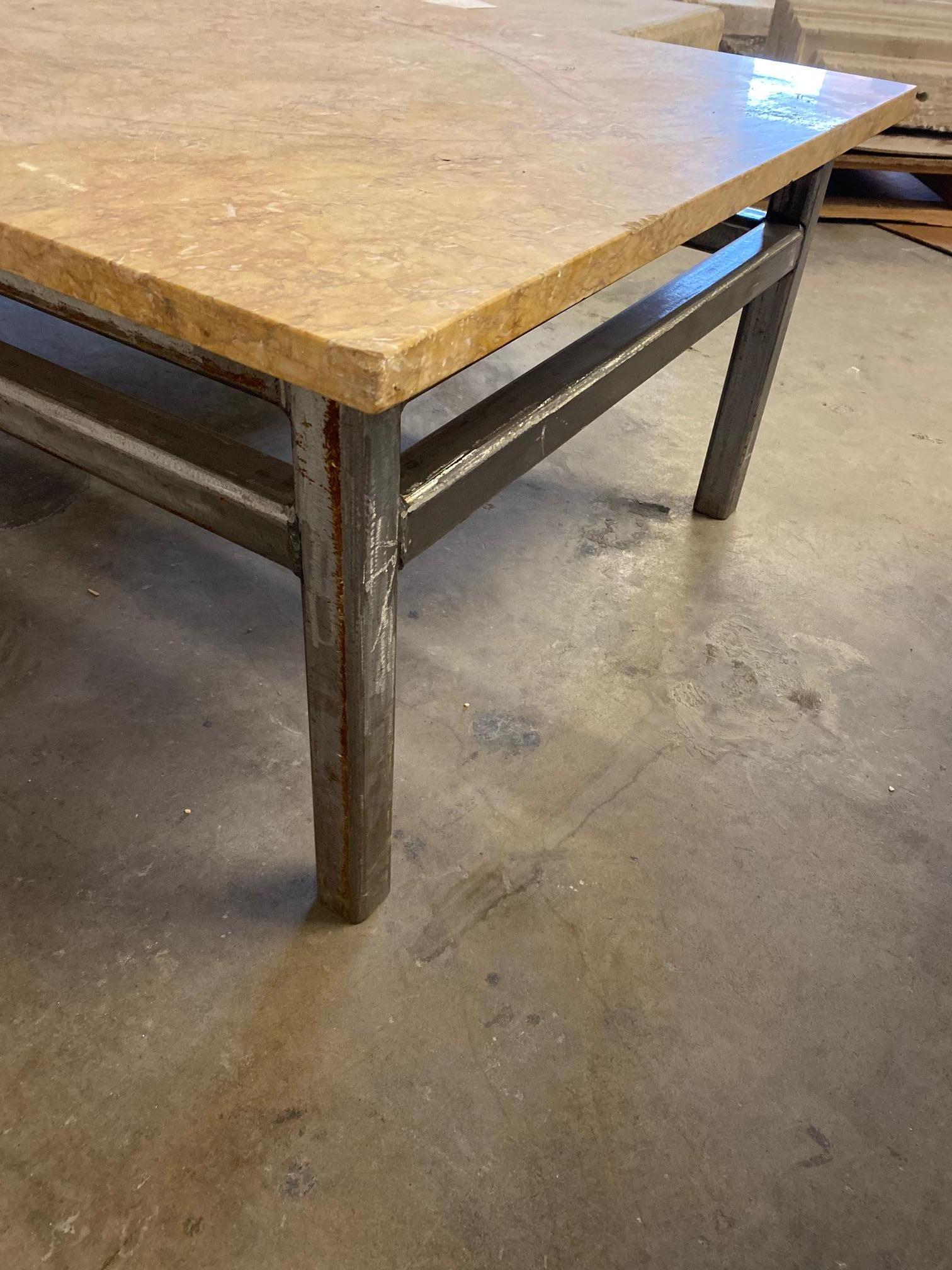 Industrial marble and steel coffee table. This tables legs are made of steel with a marble top. Great statement piece for your Industrial loft or in any contemporary setting.

The measurements are: 78.75