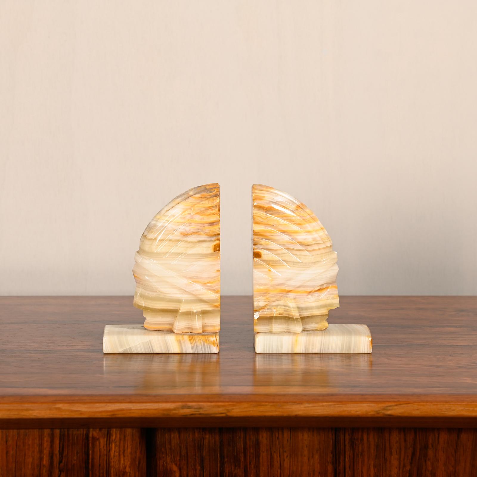 Art Deco marble bookends with carved heads of Native Americans 1