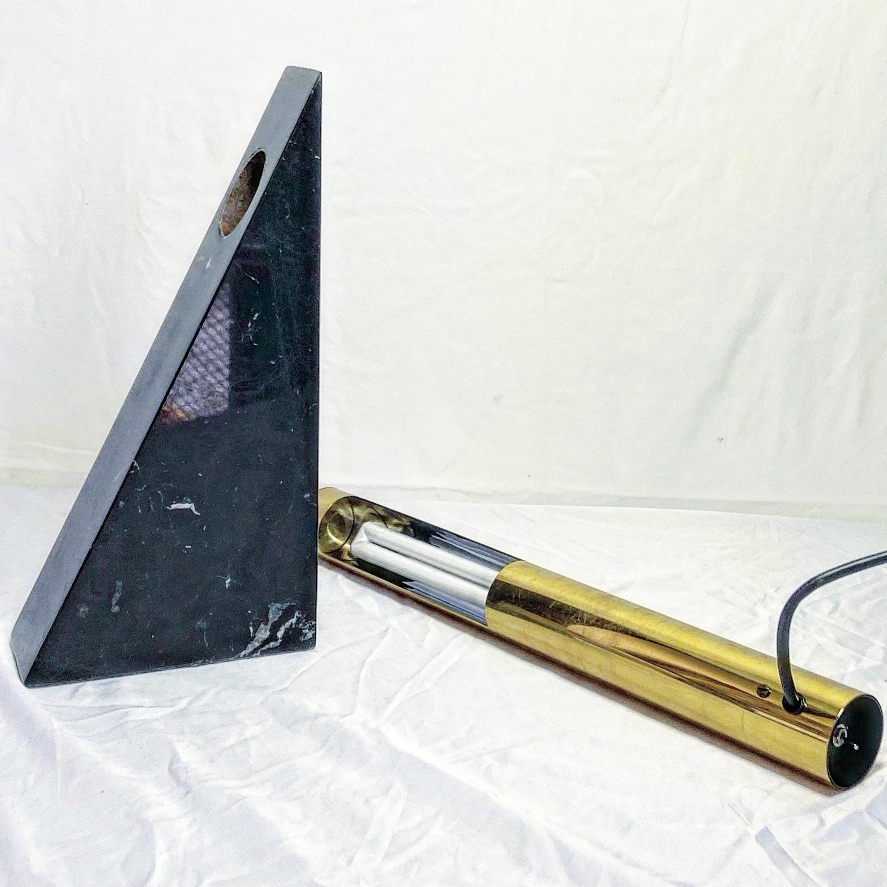Stylish Art Deco triangular marble with detachable brass tube shaped lamp.
Has a small crack towards bottom as can be seen in photos.
In excellent working condition.

Additional information:
Materials: Brass, Marble
Color: Black, Brass
Style: Art