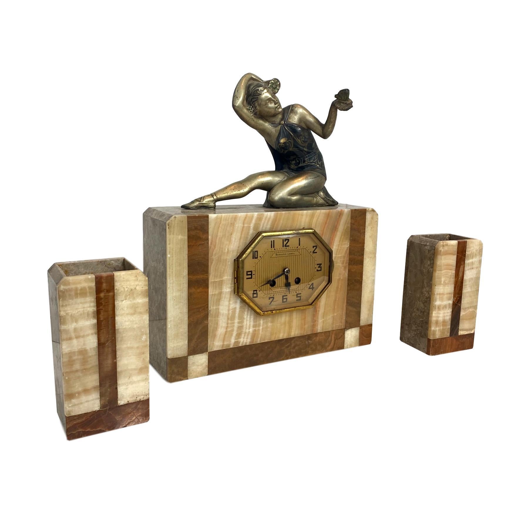Art Deco marble clock set with figure of a lady, signed Bernard Lebel, French, circa 1930s.