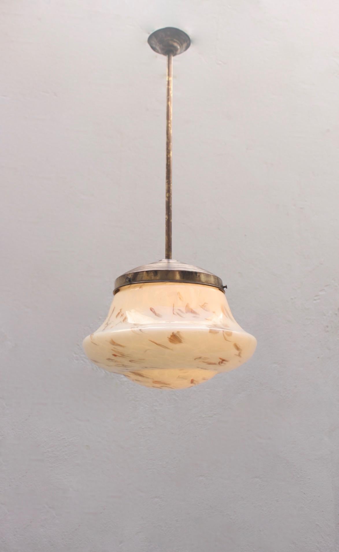 Art Deco marble glass and brass pendant Spanish lamp, 1930s.
Brass featuring patina and wear due to age and use.