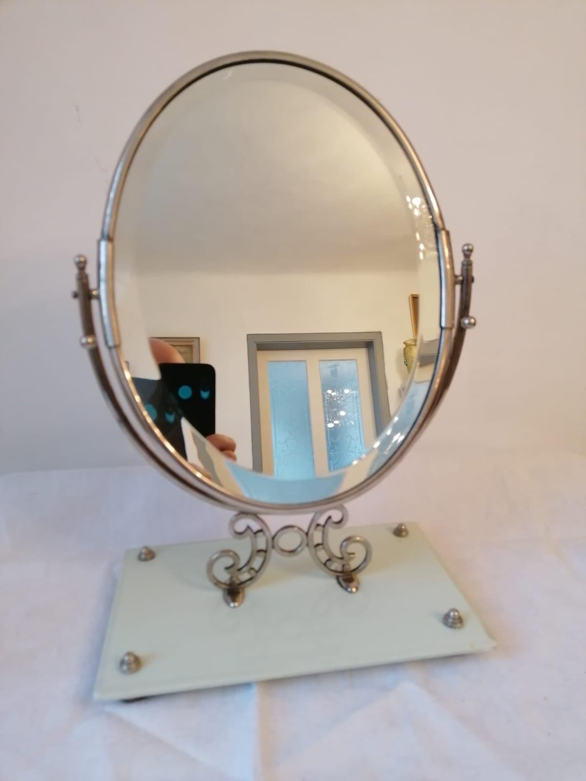 Glass base and oval frame brass chrome platted with mirror. Made in the 1930s in Austria.