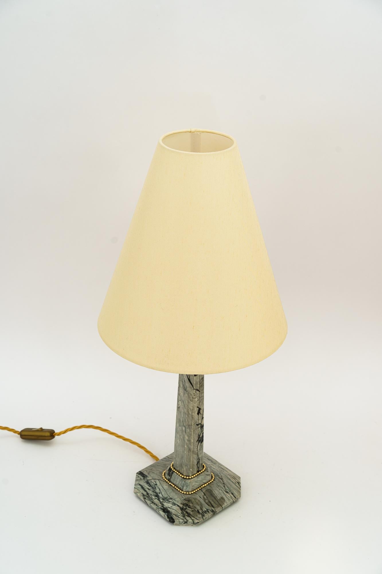 Art Deco Marble Table lamp with brass parts and fabric shade vienna around 1920s
Brass parts polished and stove enameled
The fabric shade is replaced ( new )