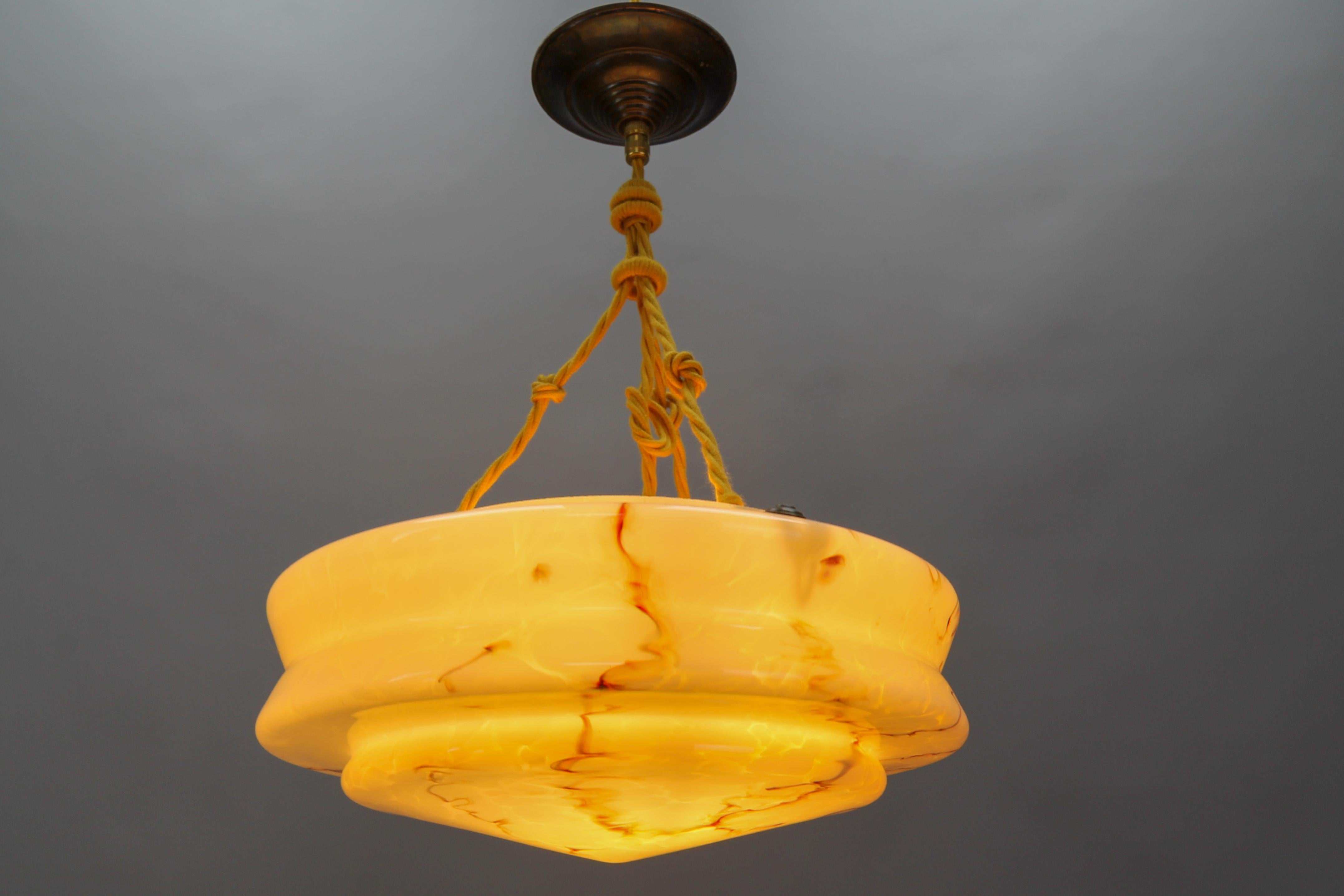 German Art Deco Marbled Amber Color Glass and Brass Pendant Light For Sale