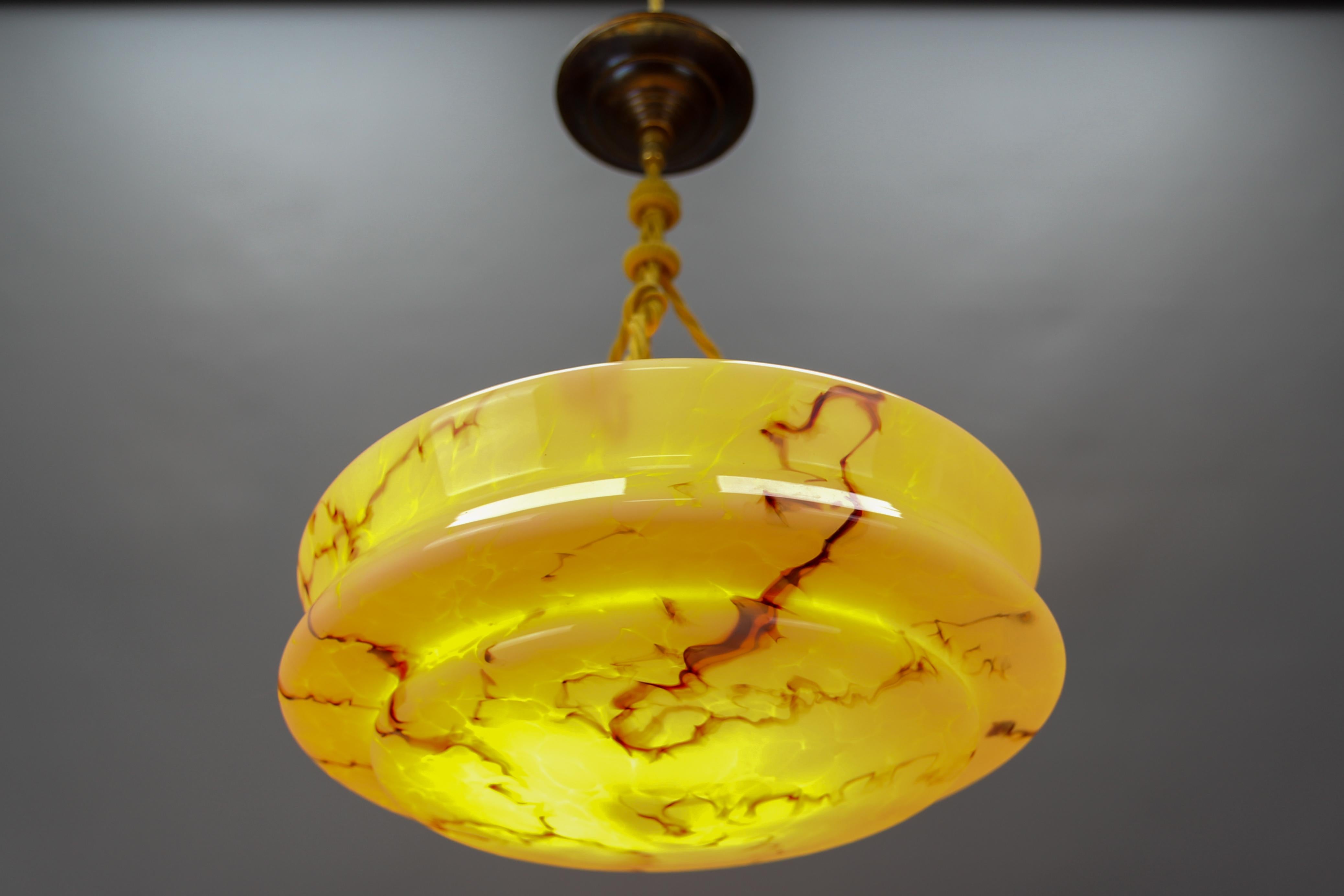 Mid-20th Century Art Deco Marbled Amber Color Glass and Brass Pendant Light For Sale