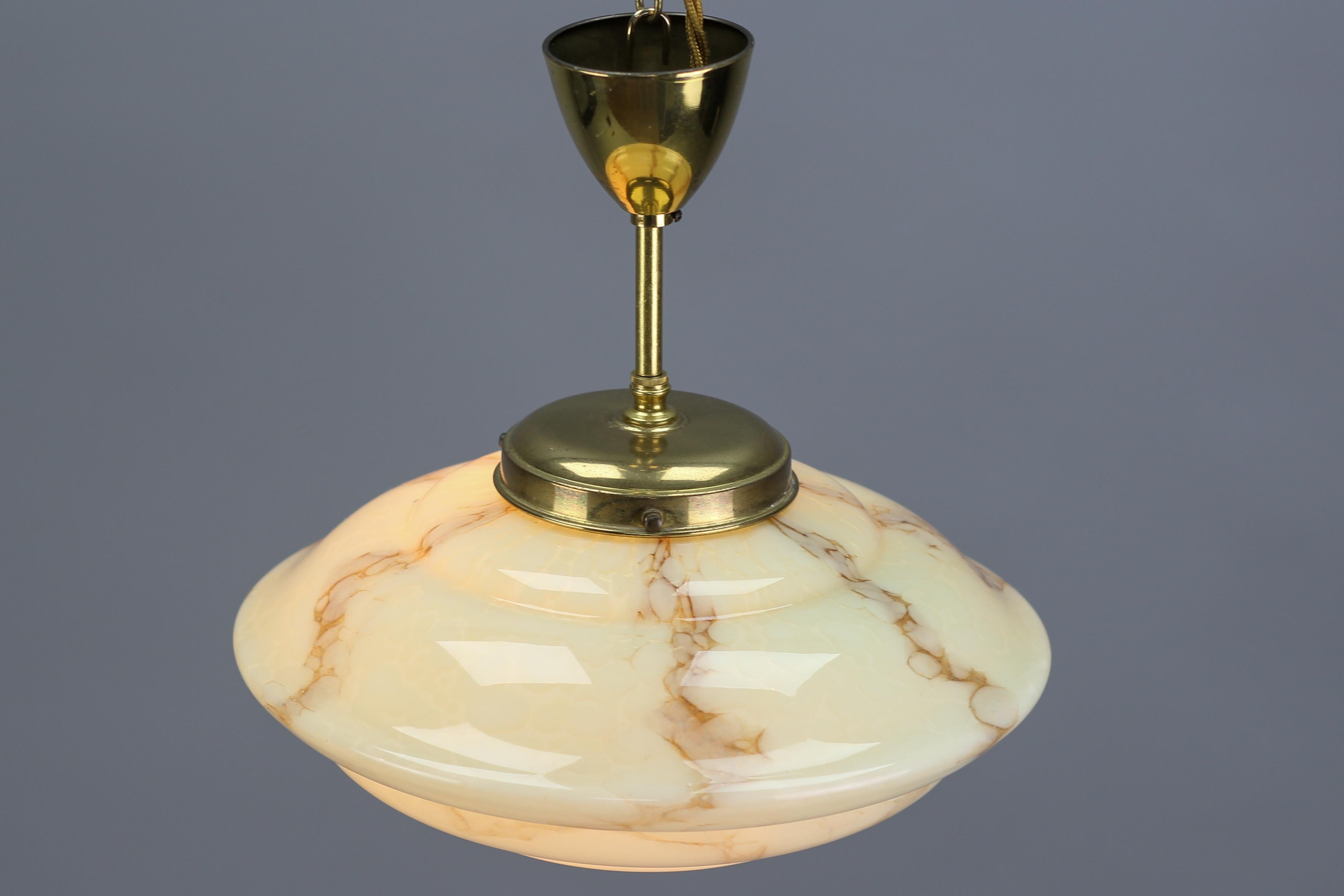 Mid-20th Century Art Deco Marbled Cream Color Glass and Brass Pendant Light, 1930s