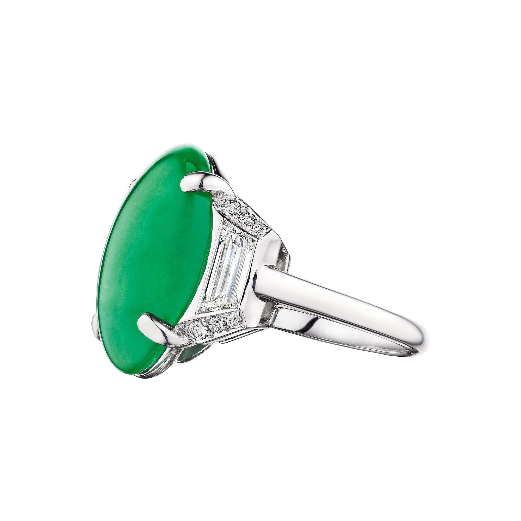 The power of jade is said to bring the wearer good luck, wealth, and prosperity, and this Art Deco Marcus & Co. natural 14.33 carat oval cabochon cut jade diamond platinum ring exudes good fortune.  Circa 1930.  AGL certification number 1141695. 