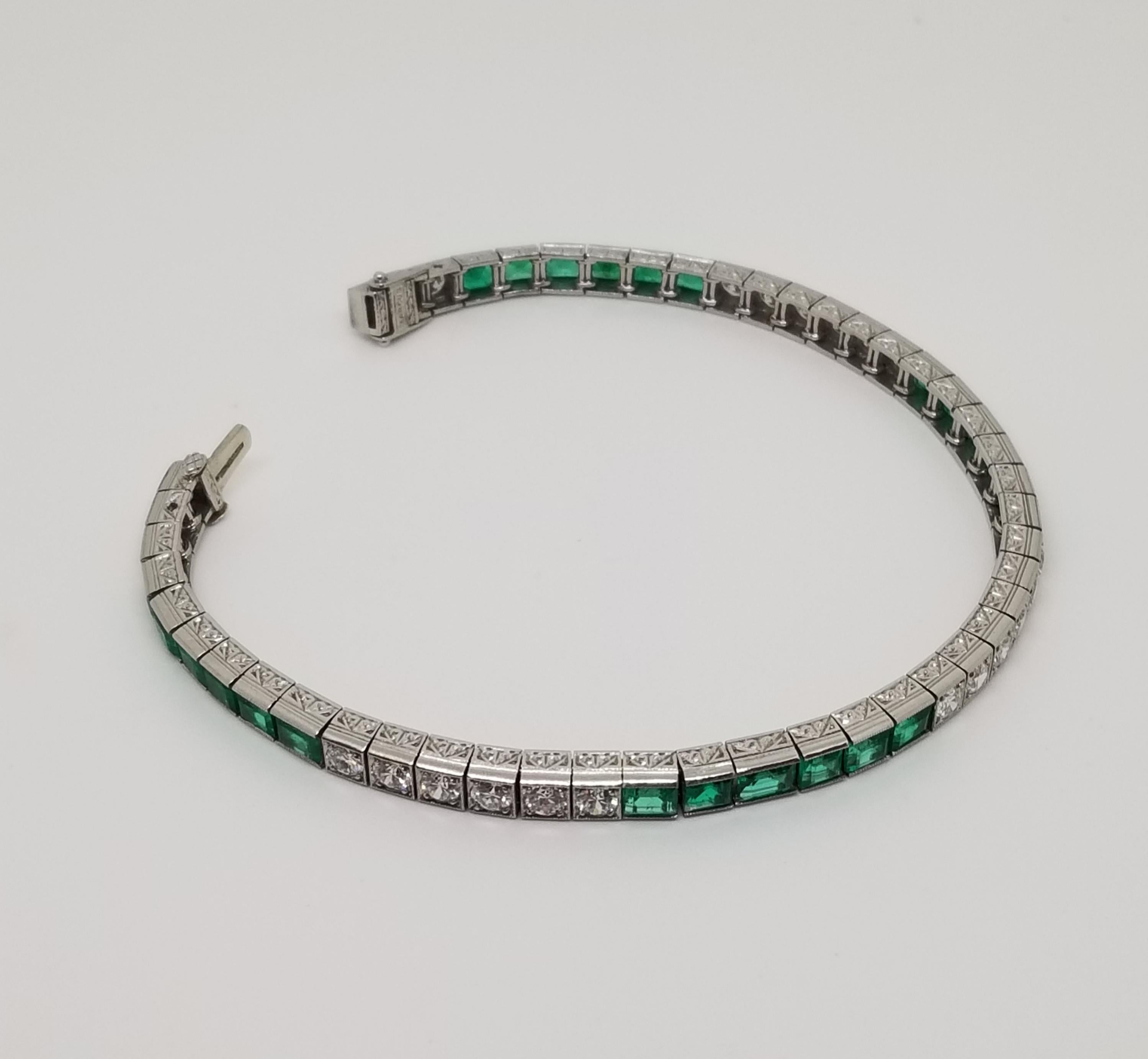 You will be perfectly lined up with this Art Deco, circa 1928, emerald and diamond heirloom bracelet.  Designed and signed Marcus & Co, this collectible line bracelet is square mounted in platinum with elegant Deco inspired side hand engraving.   24