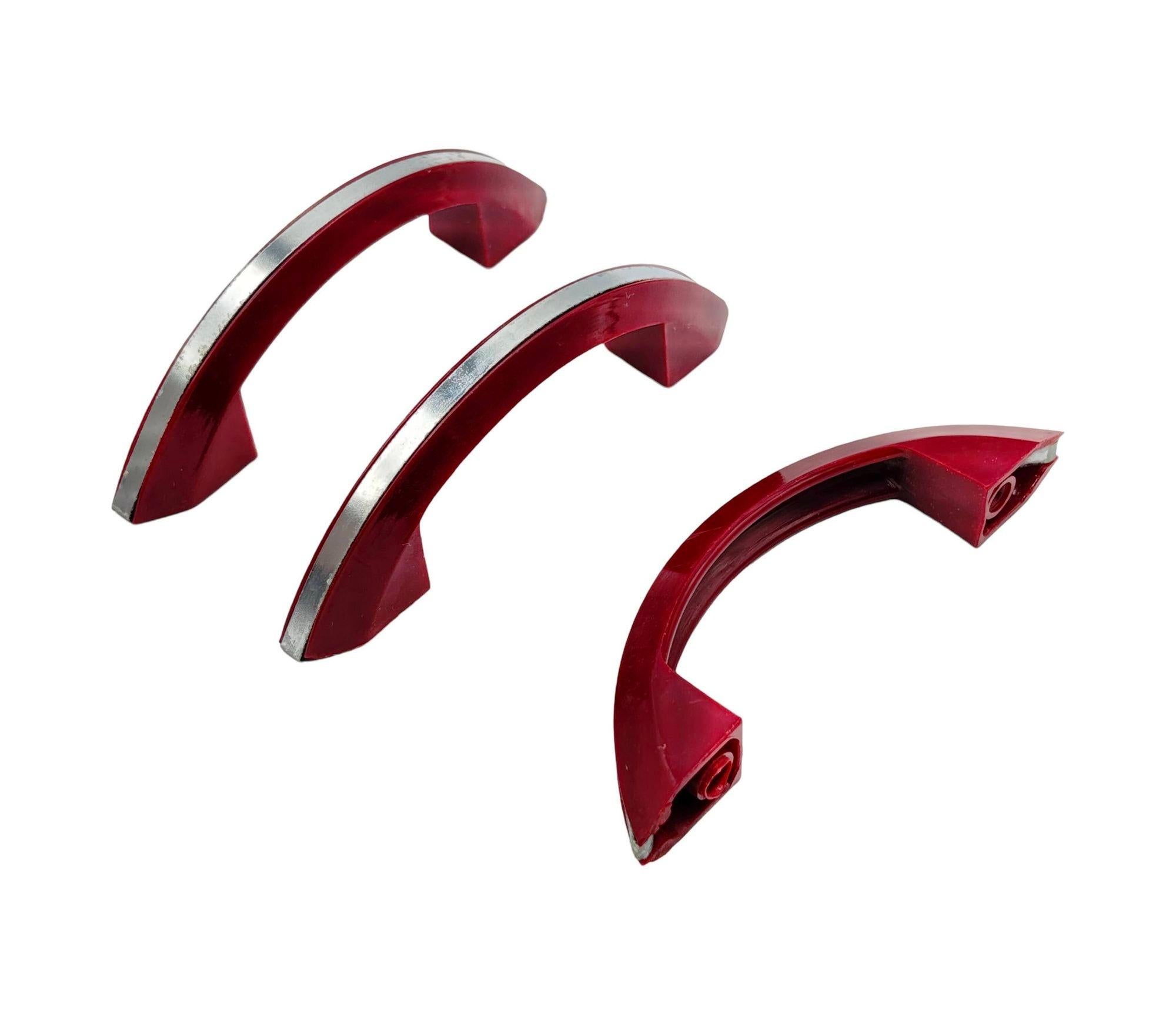 Set of 10 candy maroon red Catalin (colored Bakelite) drawer/door pull knobs each with a chrome strip down the center. Complete your period kitchen cabinetry with these classic Art Deco-era with a striking red color complemented by a sleek chrome