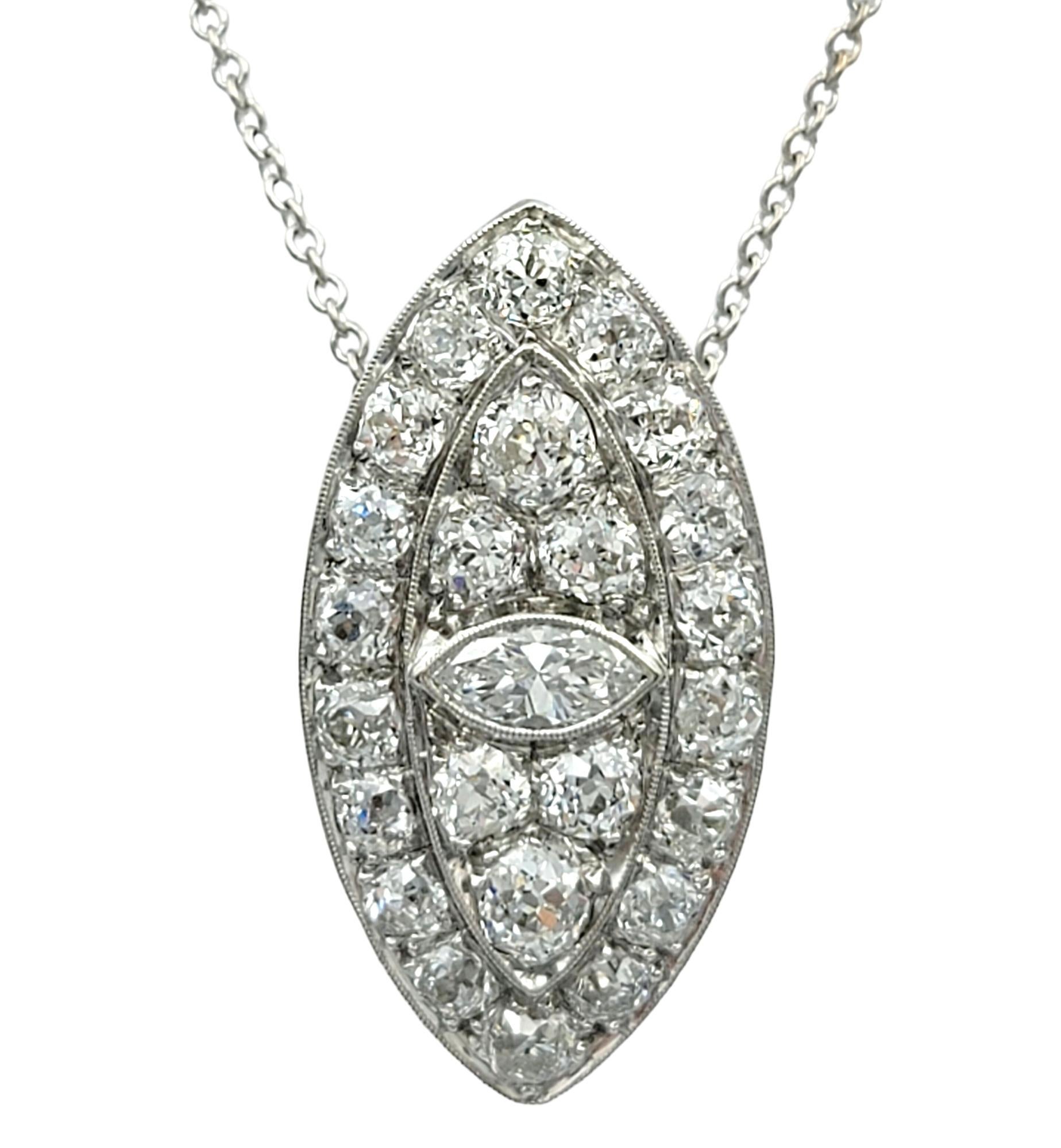 Introducing our exquisite Art Deco marquise cut diamond eye pendant crafted in luxurious polished platinum. This vertical hanging pendant features a mesmerizing marquise cut diamond at the center, surrounded by an array of Old Mine cut diamonds,