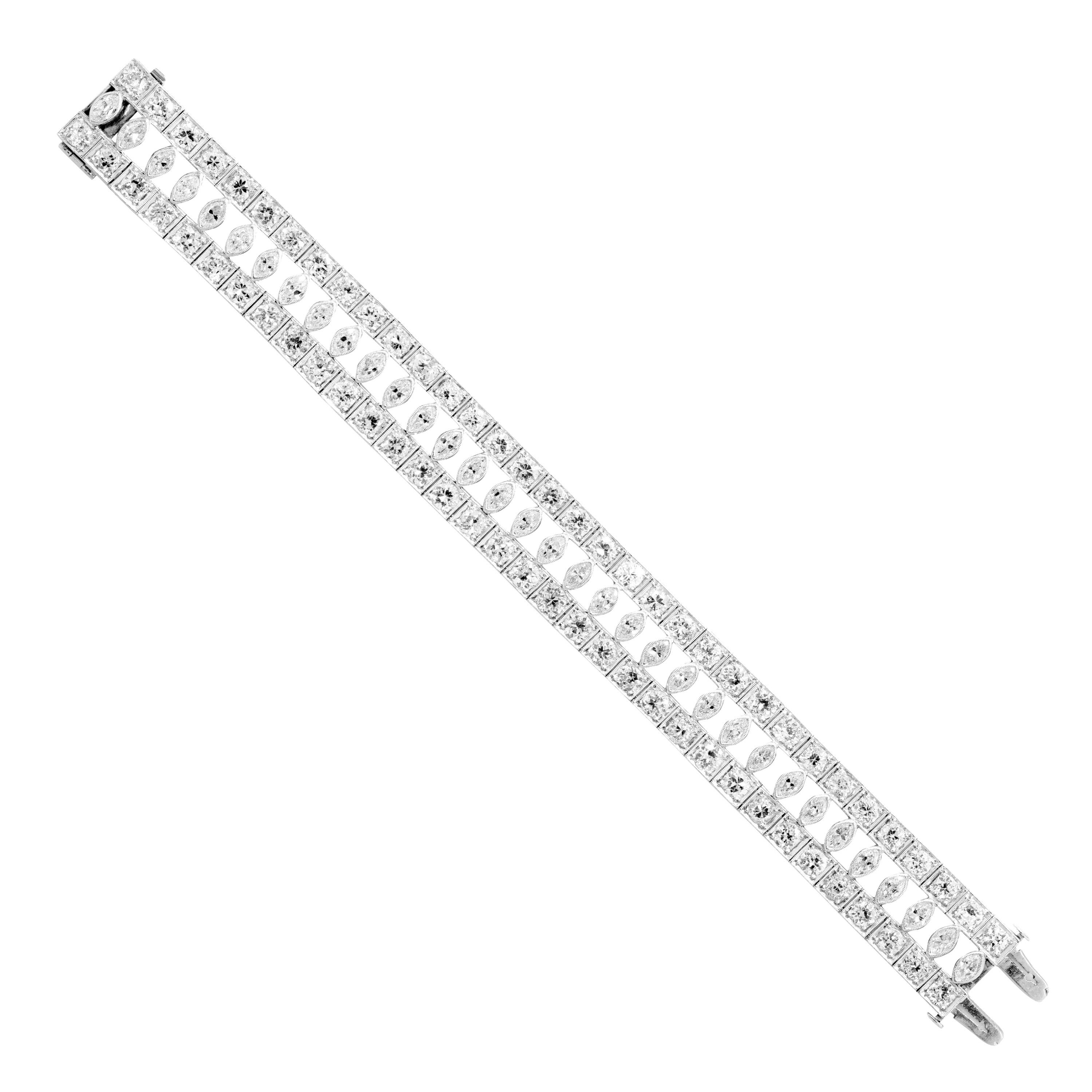 Stunning hand made art deco bracelet with two rows of box set old cut diamonds and rub over marquise diamonds in between. The approximate total diamond weight is 21.50 carats with thirty four marquise diamonds and sixty eight round old cut diamonds.