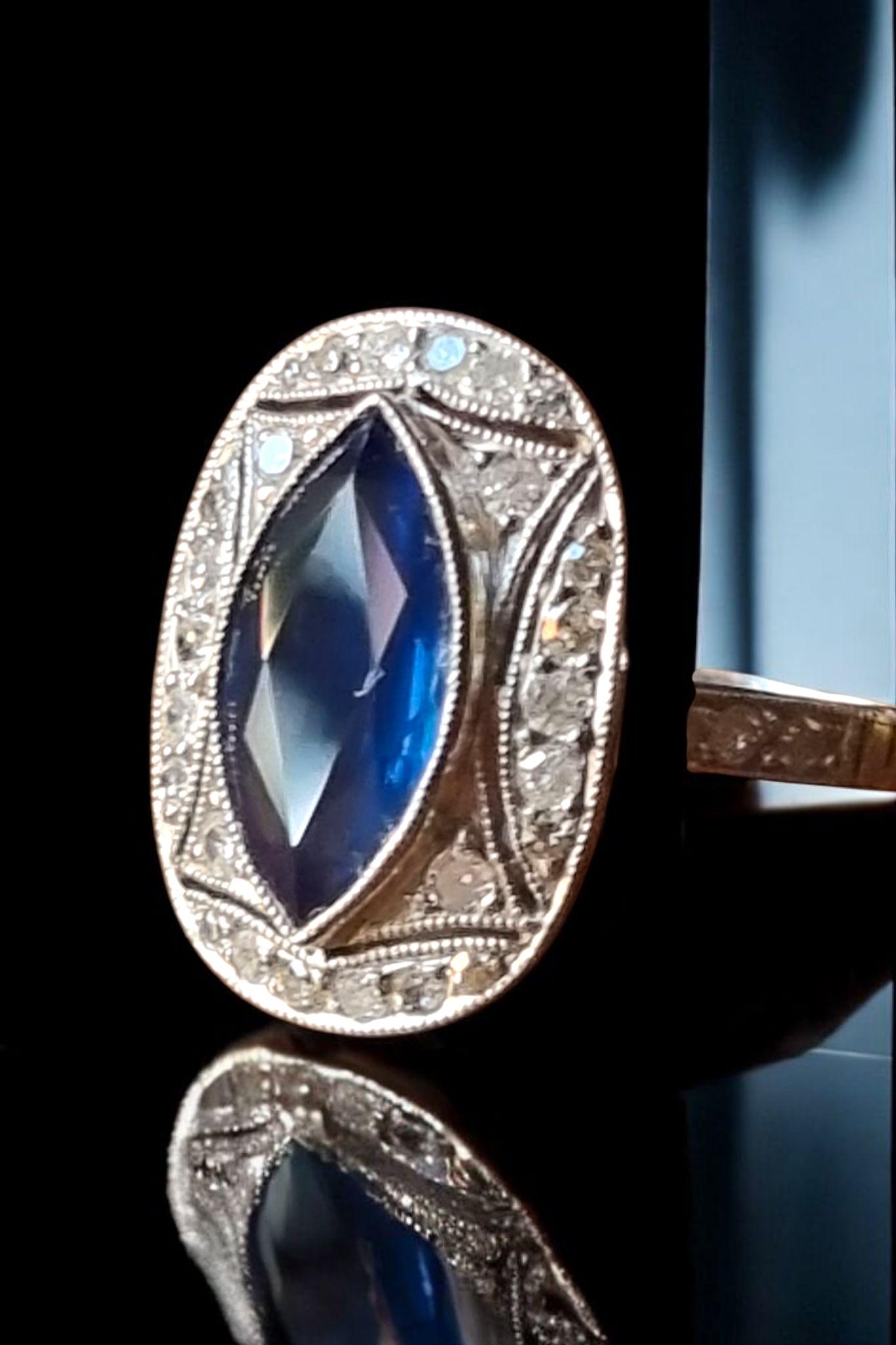 Art Deco Marquise Blue Sapphire and Diamond Ring  mounted in Platinum. Ca.1925
Art Deco platinum ring starring an elegantly modeled marquise blue sapphire weighing 1.78 carats approx. (11,70X5,80X3.37mm) The enchanting royal-blue gemstone is set in