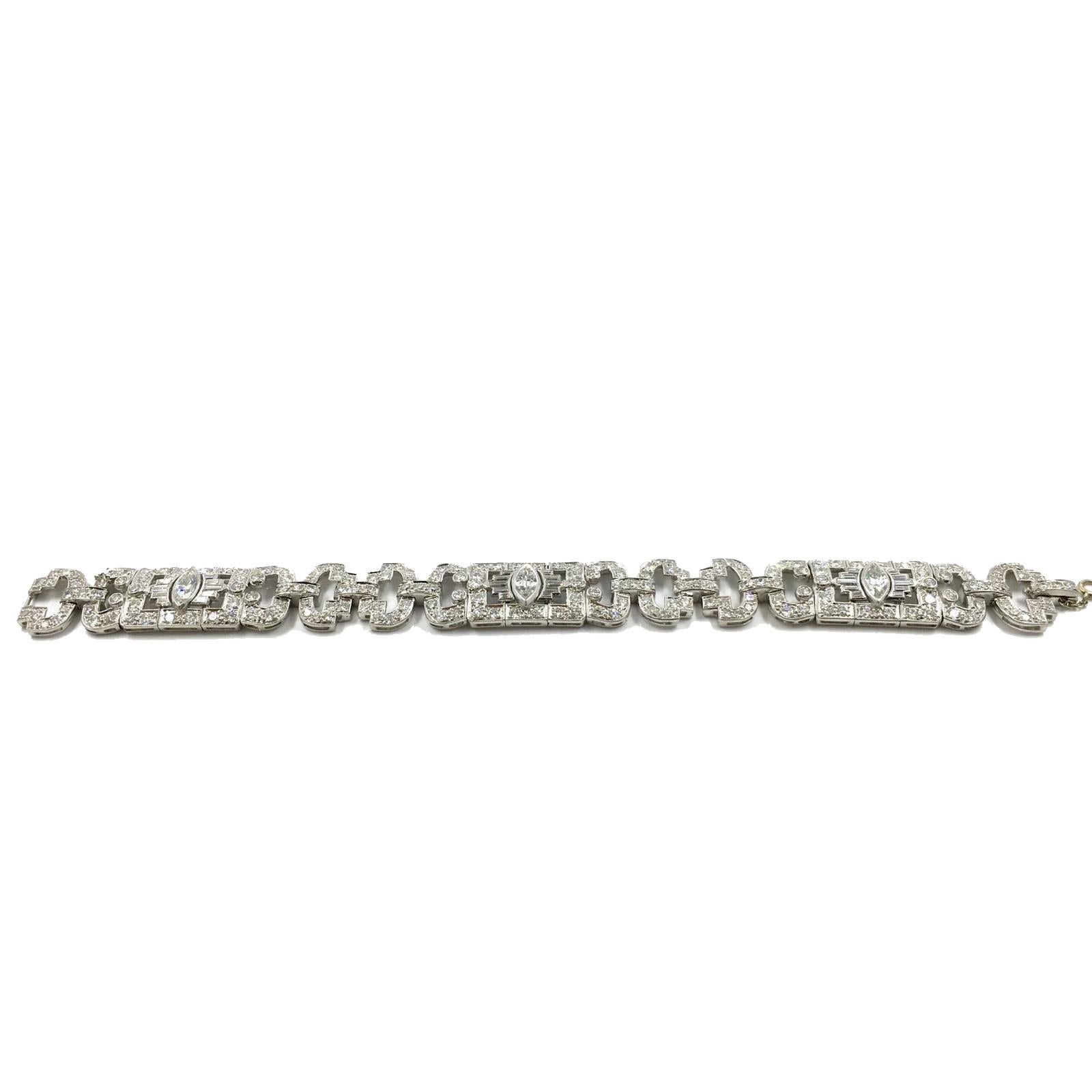 Style: Chain Link Bracelet

Era: 1930’s , Art Deco

Metal: Platinum

Stones: 3 Marquise Shaped Brilliant Diamonds (VVS2 / G)

30 Tapered Baguette cut Diamonds (VVS2 / F-G)

198 Round Brilliant Cut Diamonds (VS1 / G)
Total Carat Weight: 14 Total