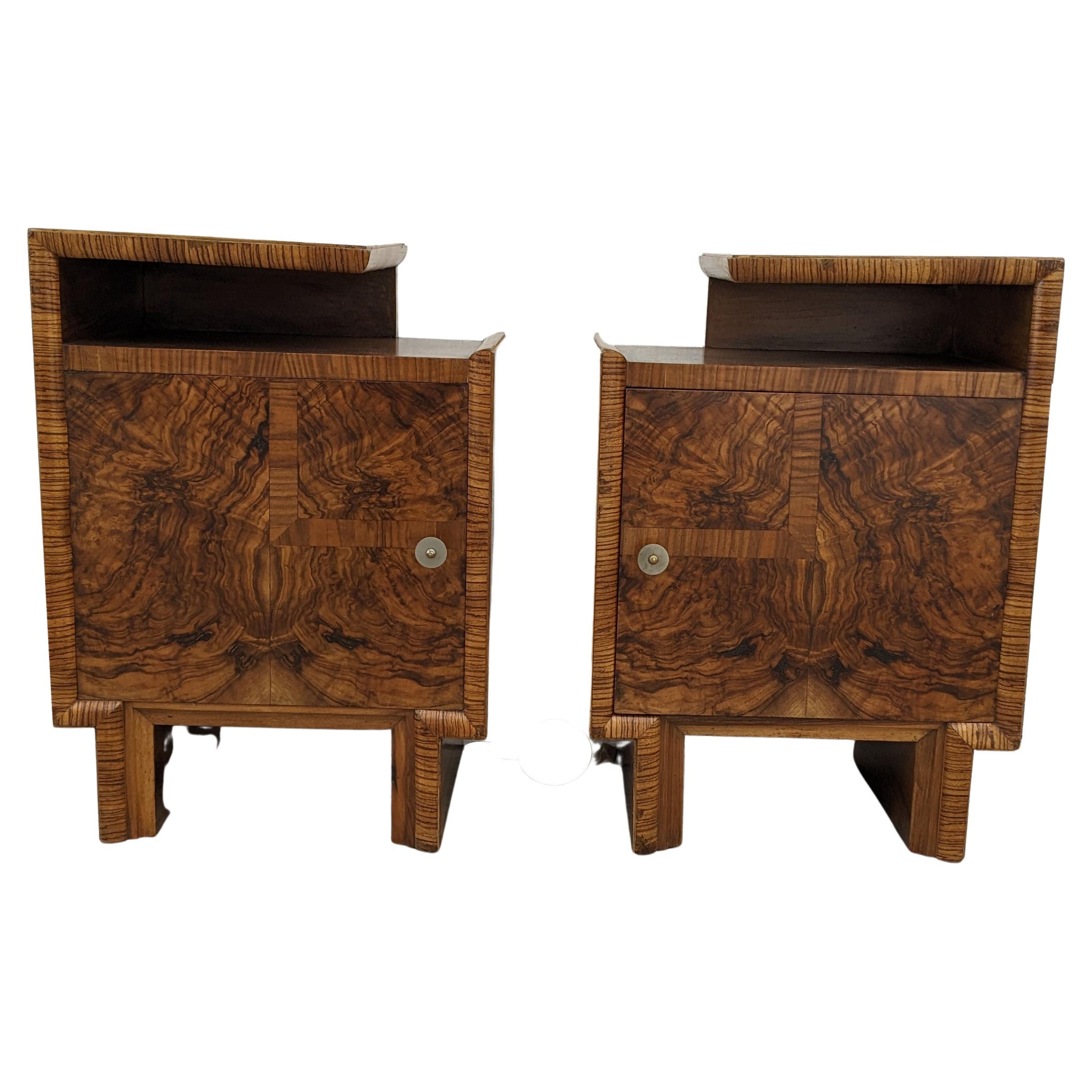 A rare opportunity to acquire such a high styled pair of original Art Deco bedside table nightstands. Originating from Italy and dating to the early 1930s they fill both the highly desired shape of Art Deco at its best with the luscious exotic