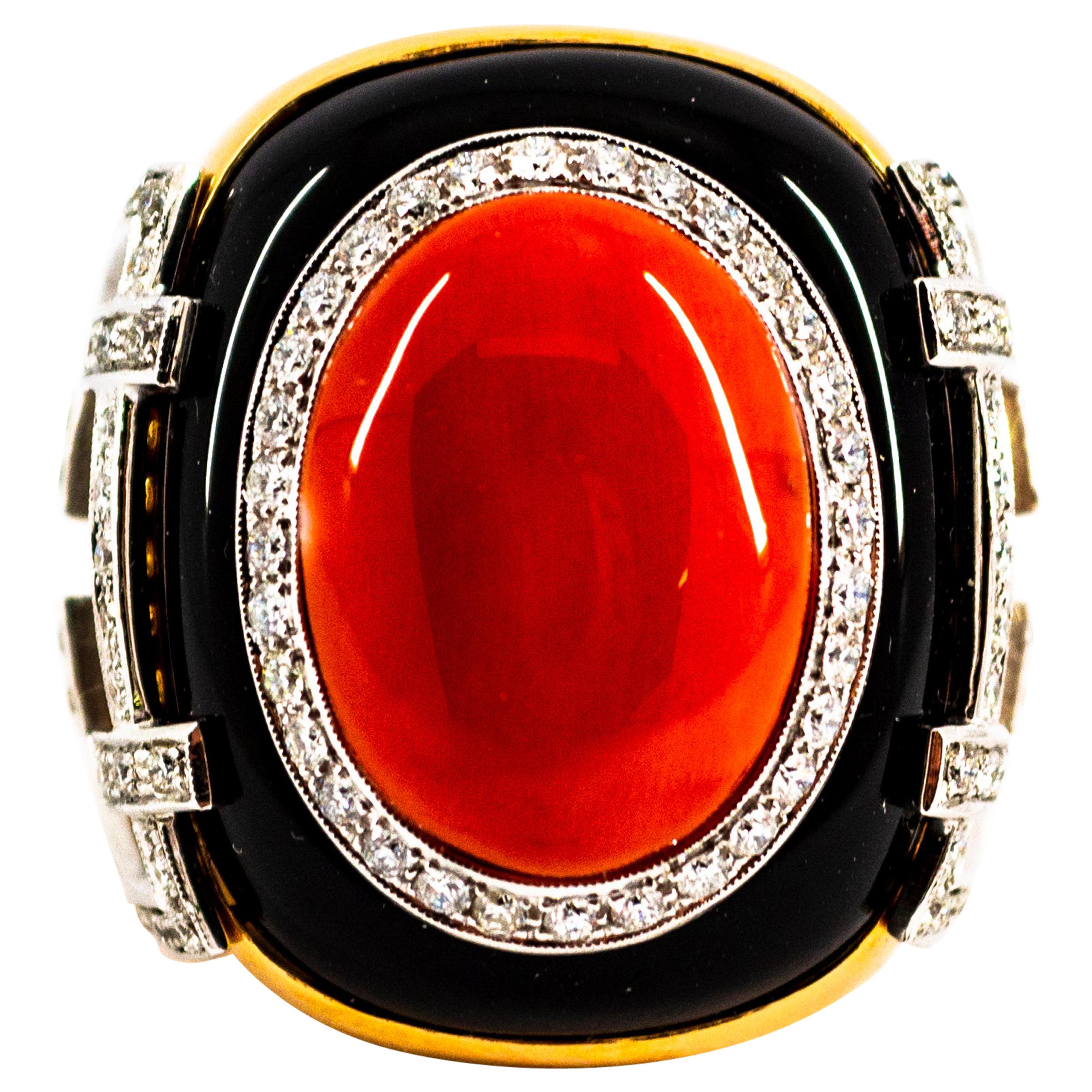 This Ring is made of 14K Yellow Gold.
This Ring has 1.00 Carats of White Brilliant Cut Diamonds.
This Ring has also a Red Mediterranean (Sardinia, Italy) Coral and Onyx.
This Ring is inspired by Art Deco.

This Ring is available also with a central